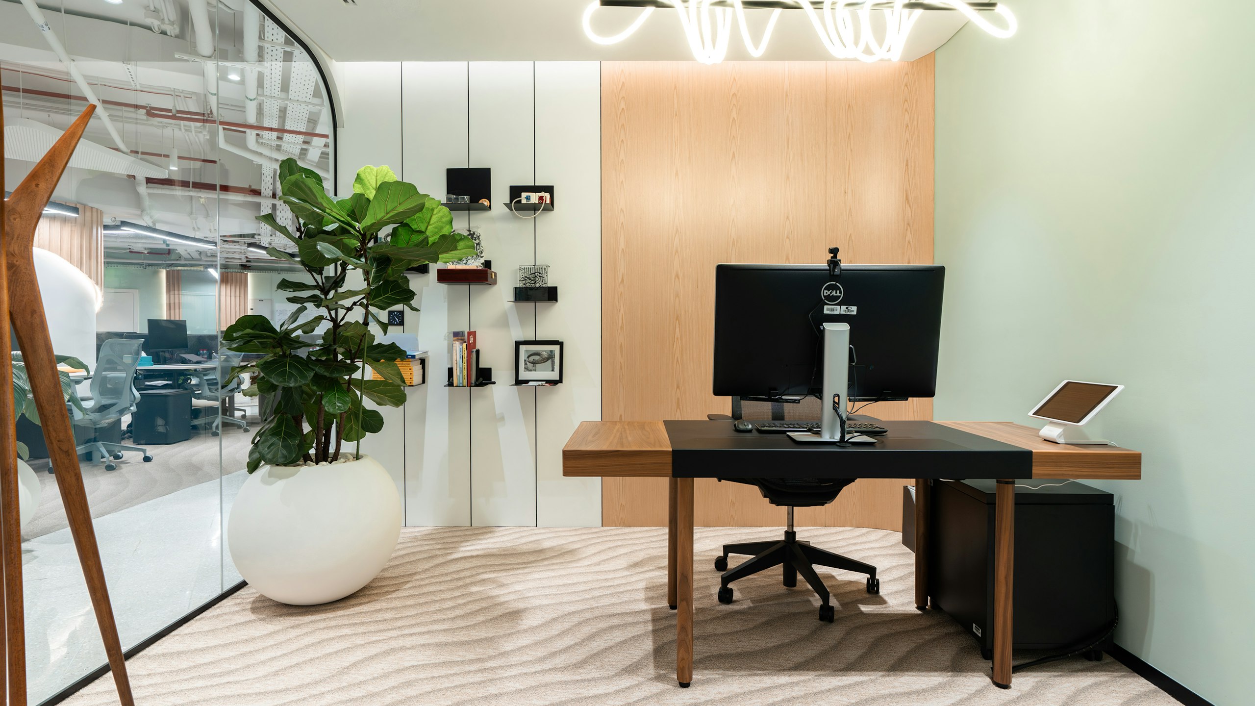 Private office with a height-adjustable Leatherwrap Sit-to-Stand Desk and high back Cosm Chair.