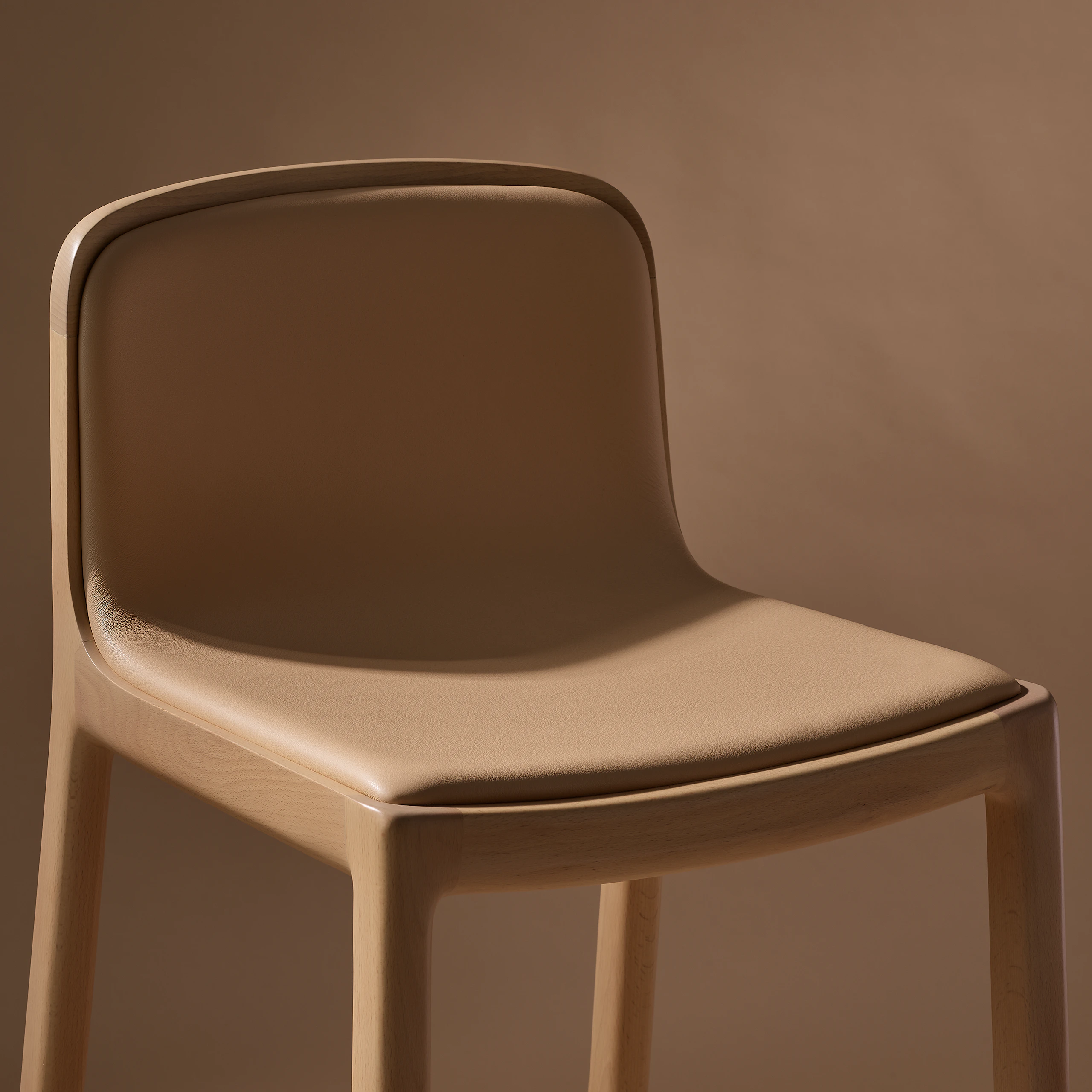 Lijn Stool by Carole Baijings for Geiger in Light Beech frame upholstered with Maharam Prone Leather in Balsa, detail shot on a neutral background.