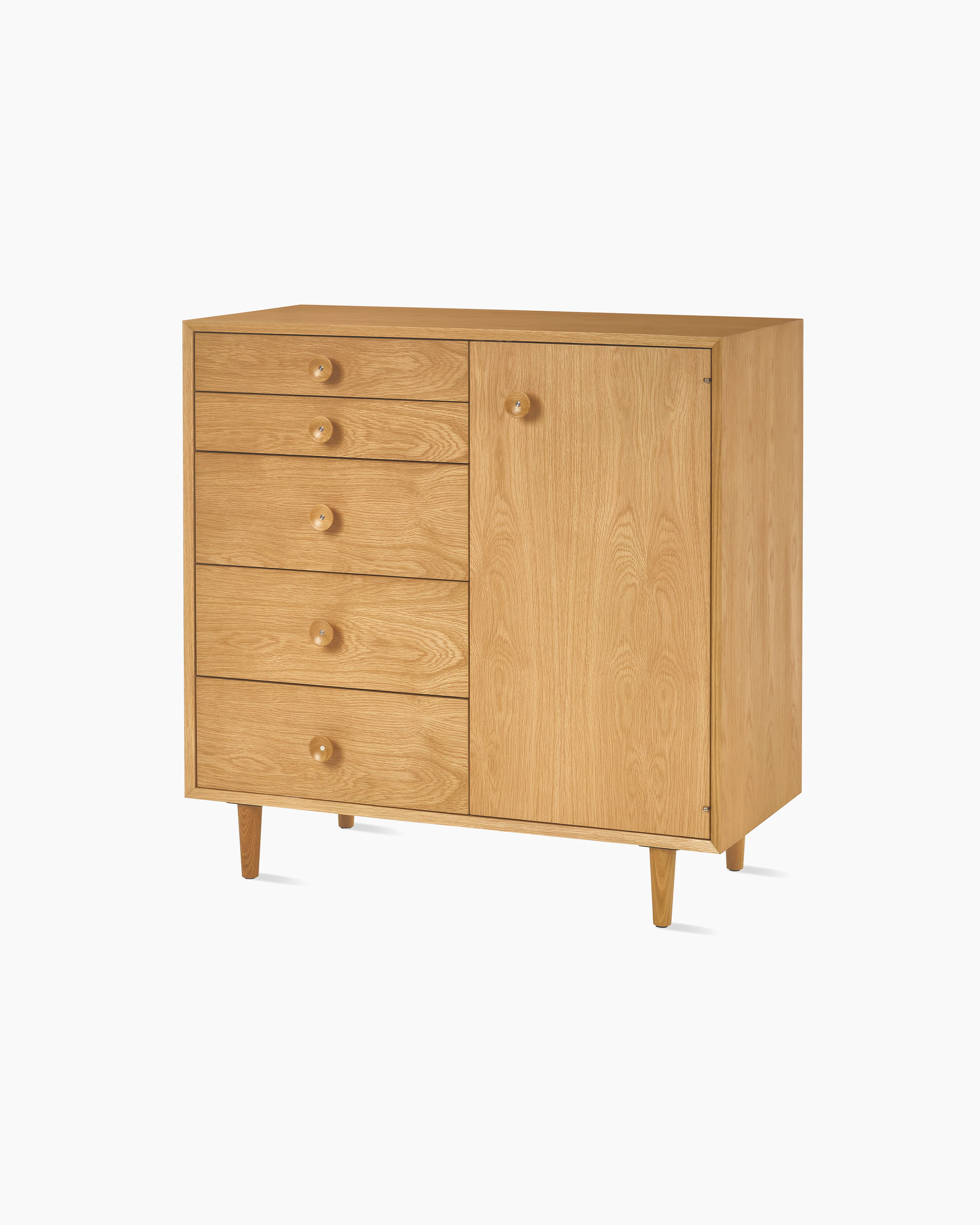 Nelson Basic Cabinet Series 5 drawers, one door, taper legs, cupcake pulls, in natural oak.