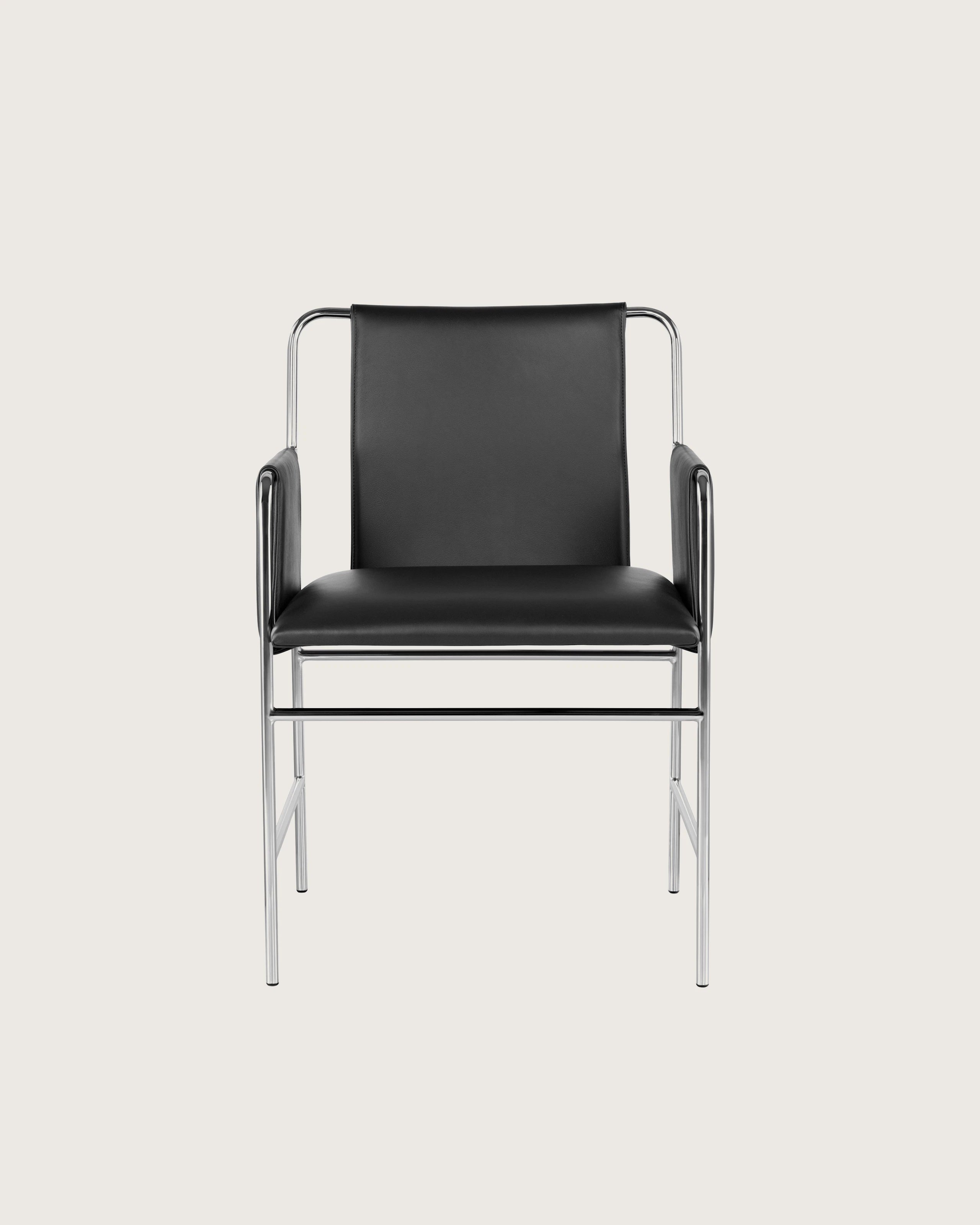 An Envelope side chair with black leather upholstery and a tubular steel frame, viewed from the front.