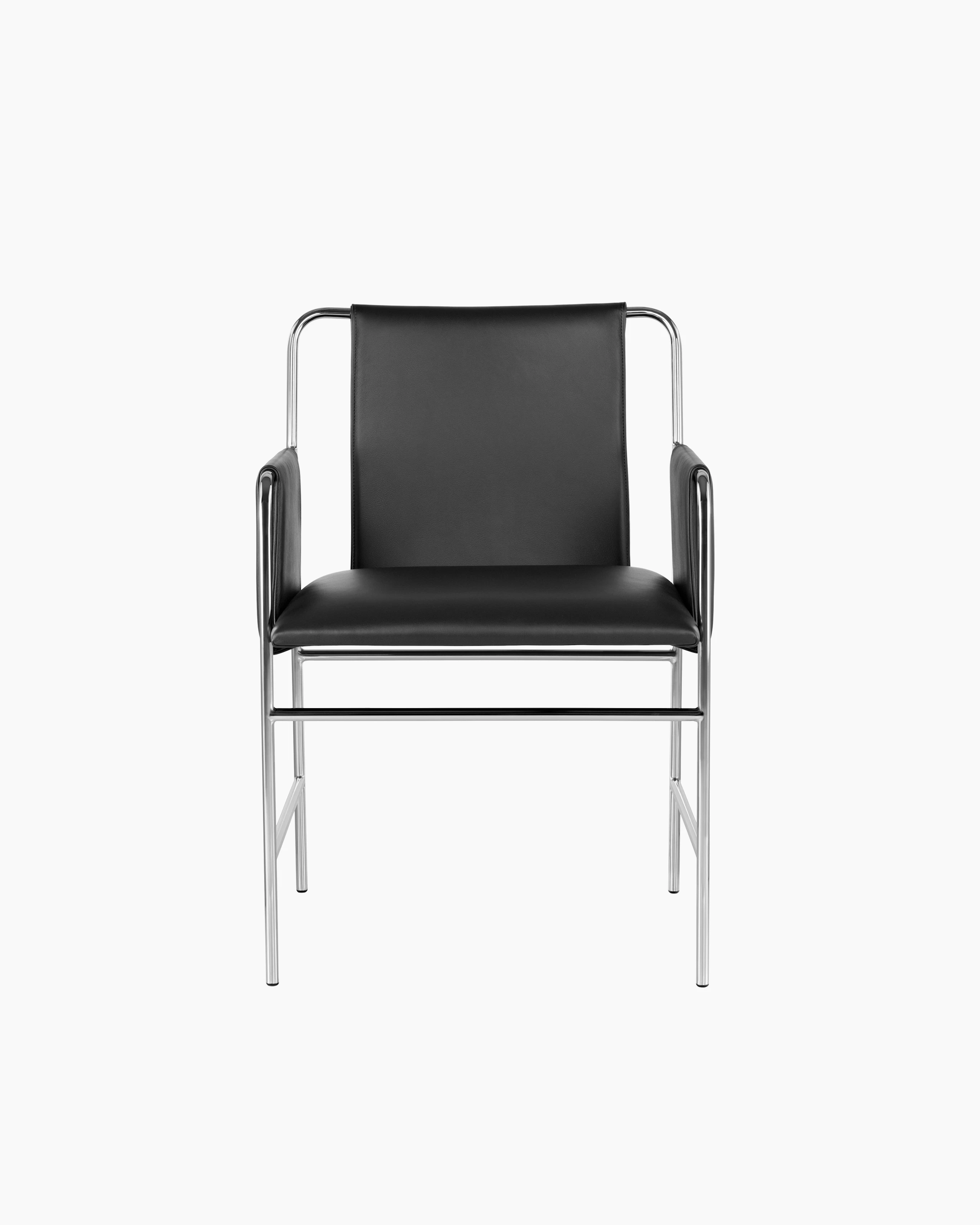 An Envelope side chair with black leather upholstery and a tubular steel frame, viewed from the front.