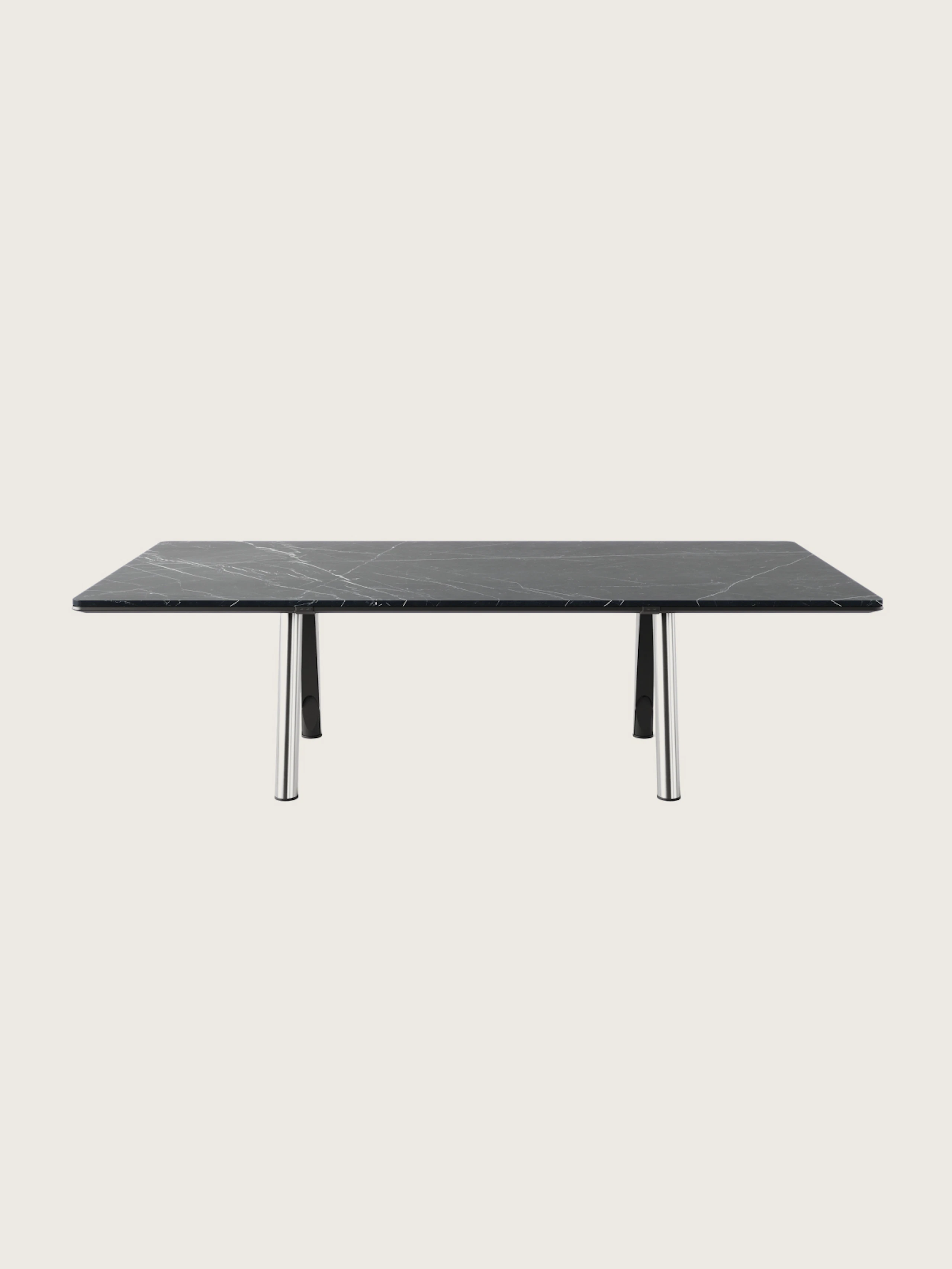 Ascent Conference Table designed by EOOS in Nero Marquina marble with a chrome base shown front-facing on a white sweep.