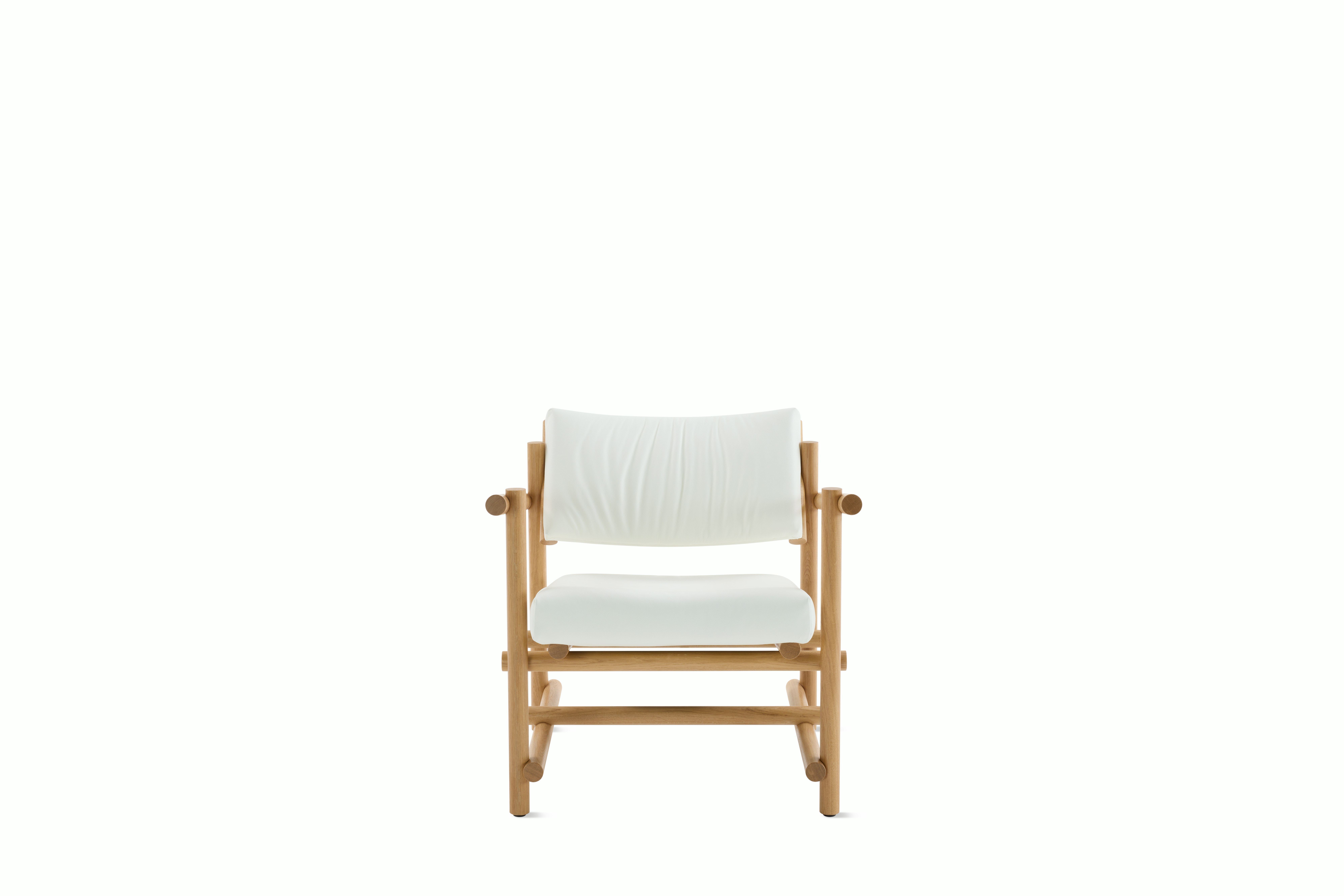 A Muecke Lounge Chair in White White Oak viewed from the front.
