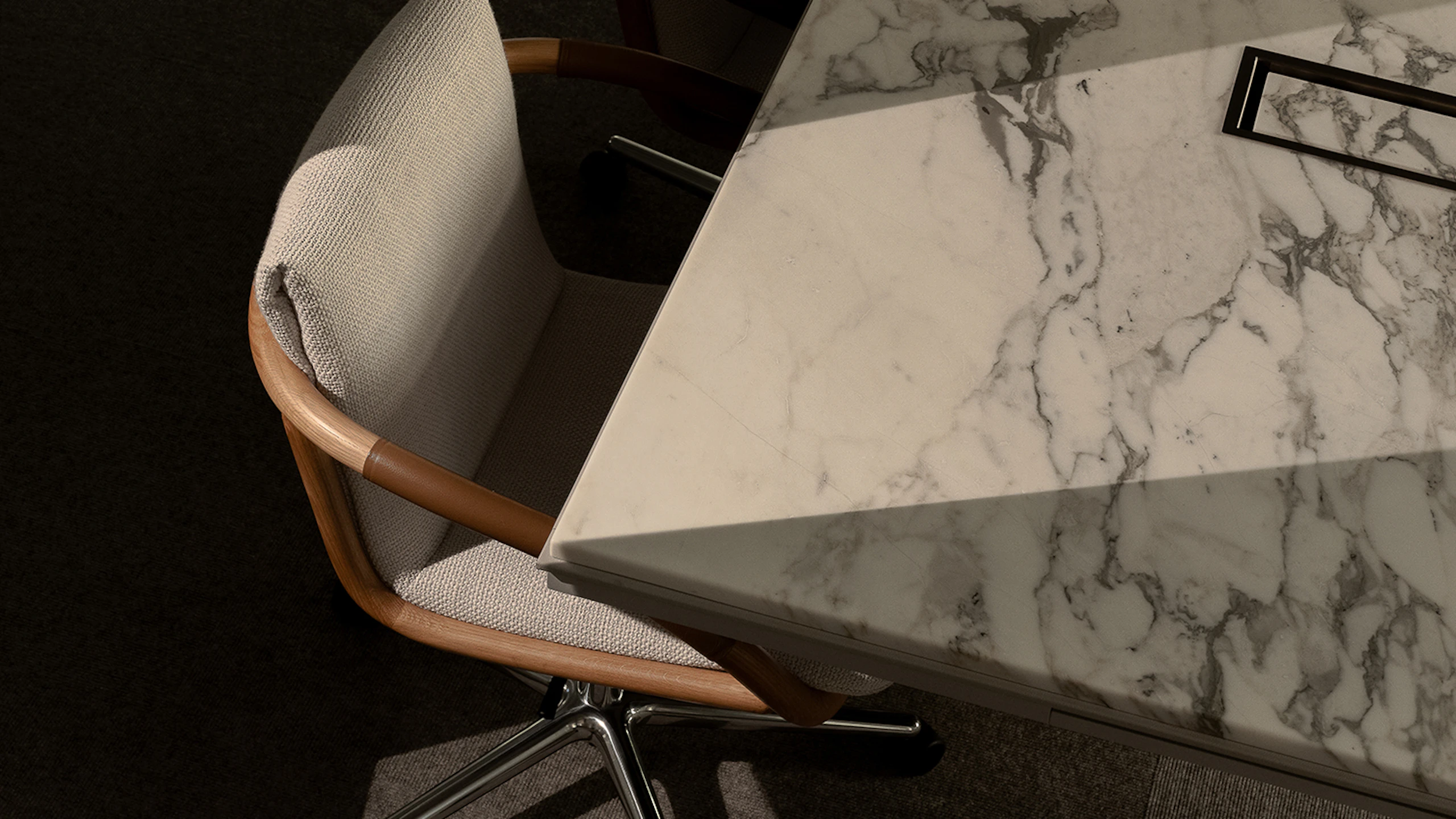 Full Loop chairs surrounding a Highline Conference table in the New York Geiger showroom
