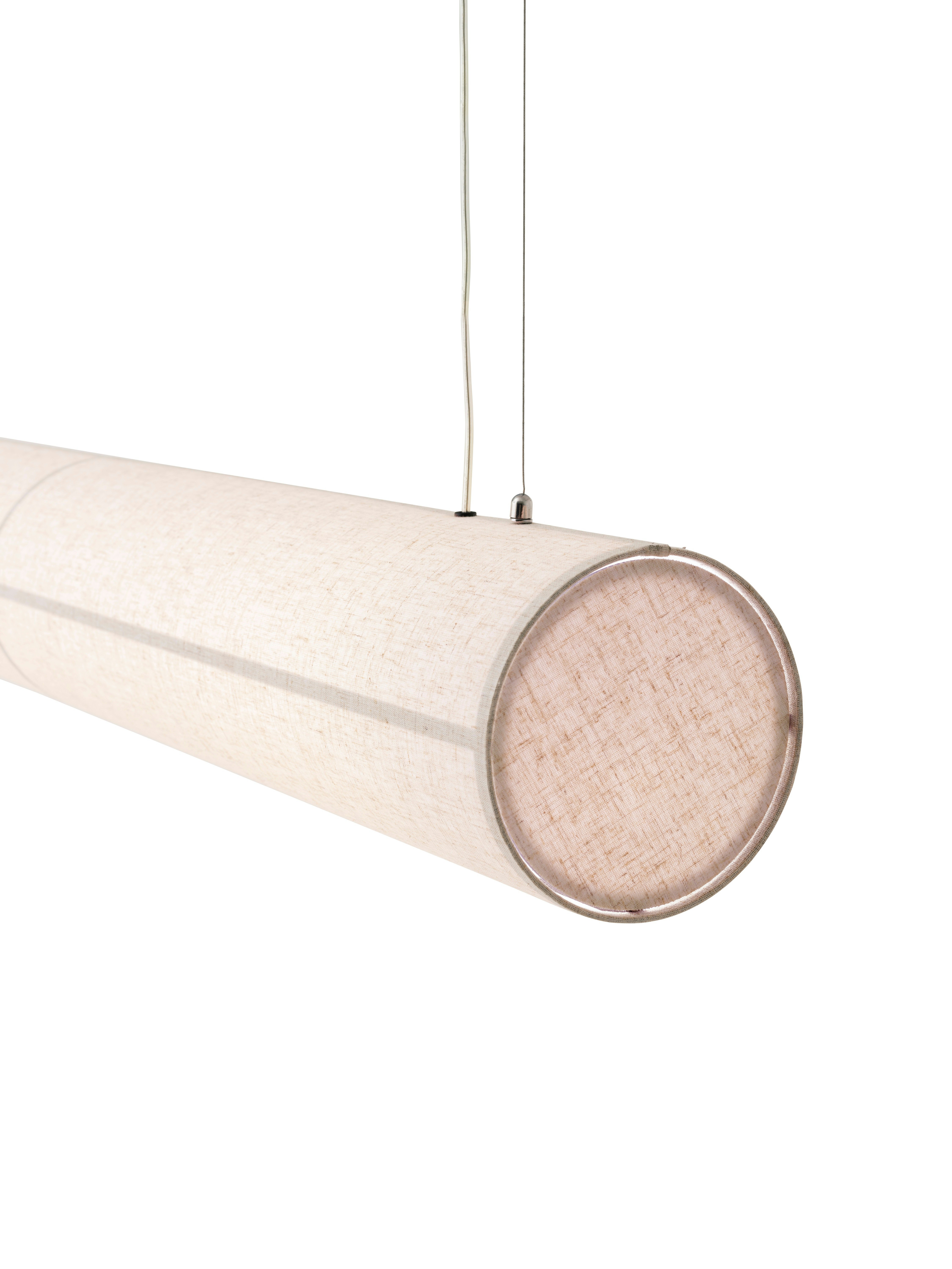 A detail view of a Hashira Linear Pendant Lamp: Ivory.