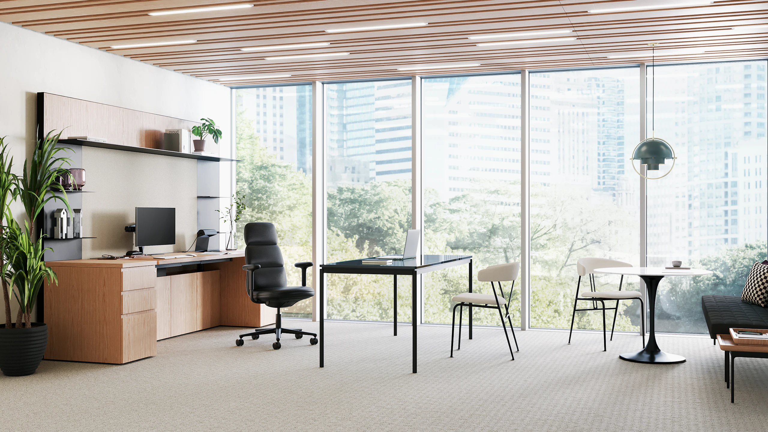 A high-back Asari chair in black leather in a large private office with storage, desk and round table side chairs.