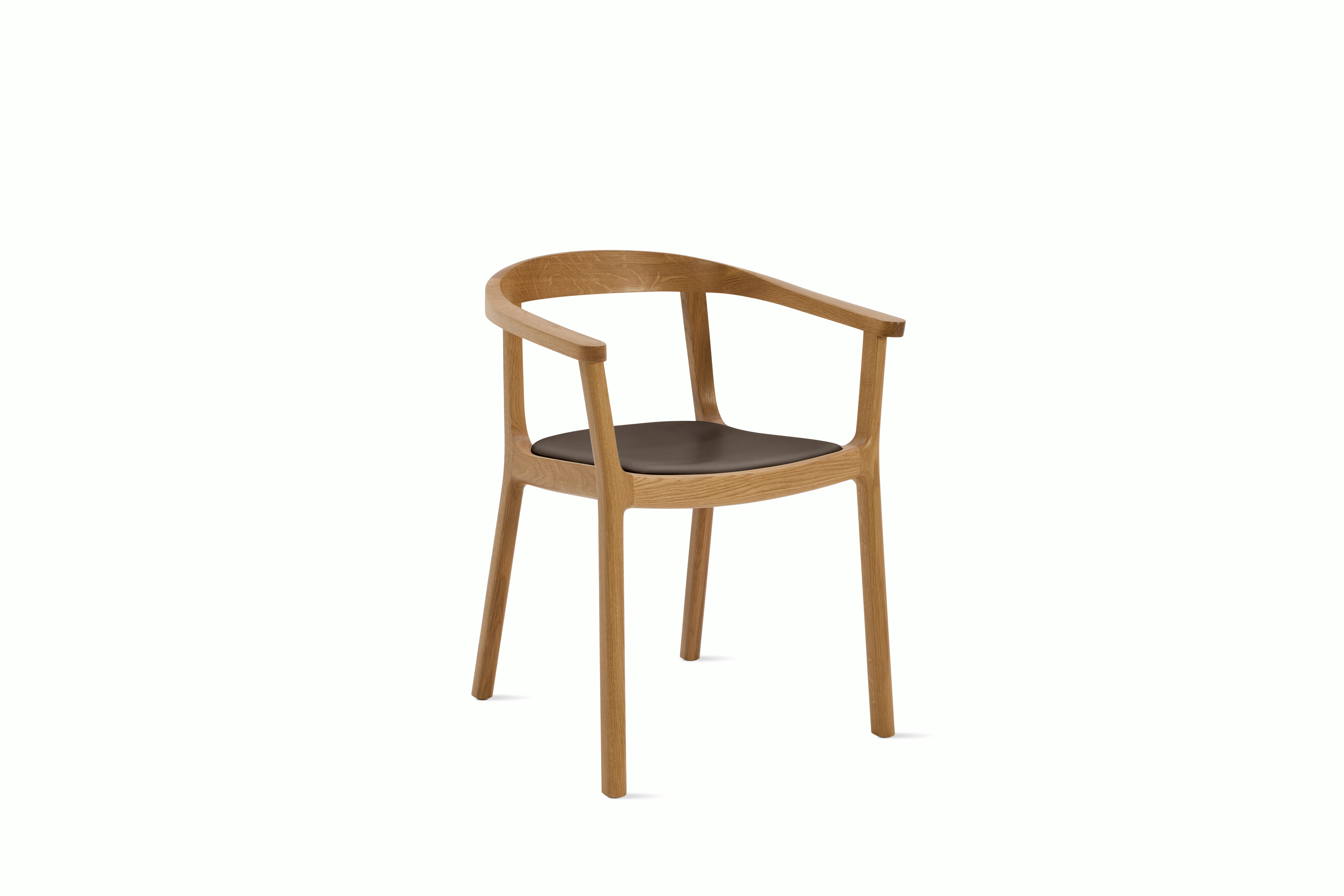 A Lijn Armchair in Java Oak viewed from an angle.