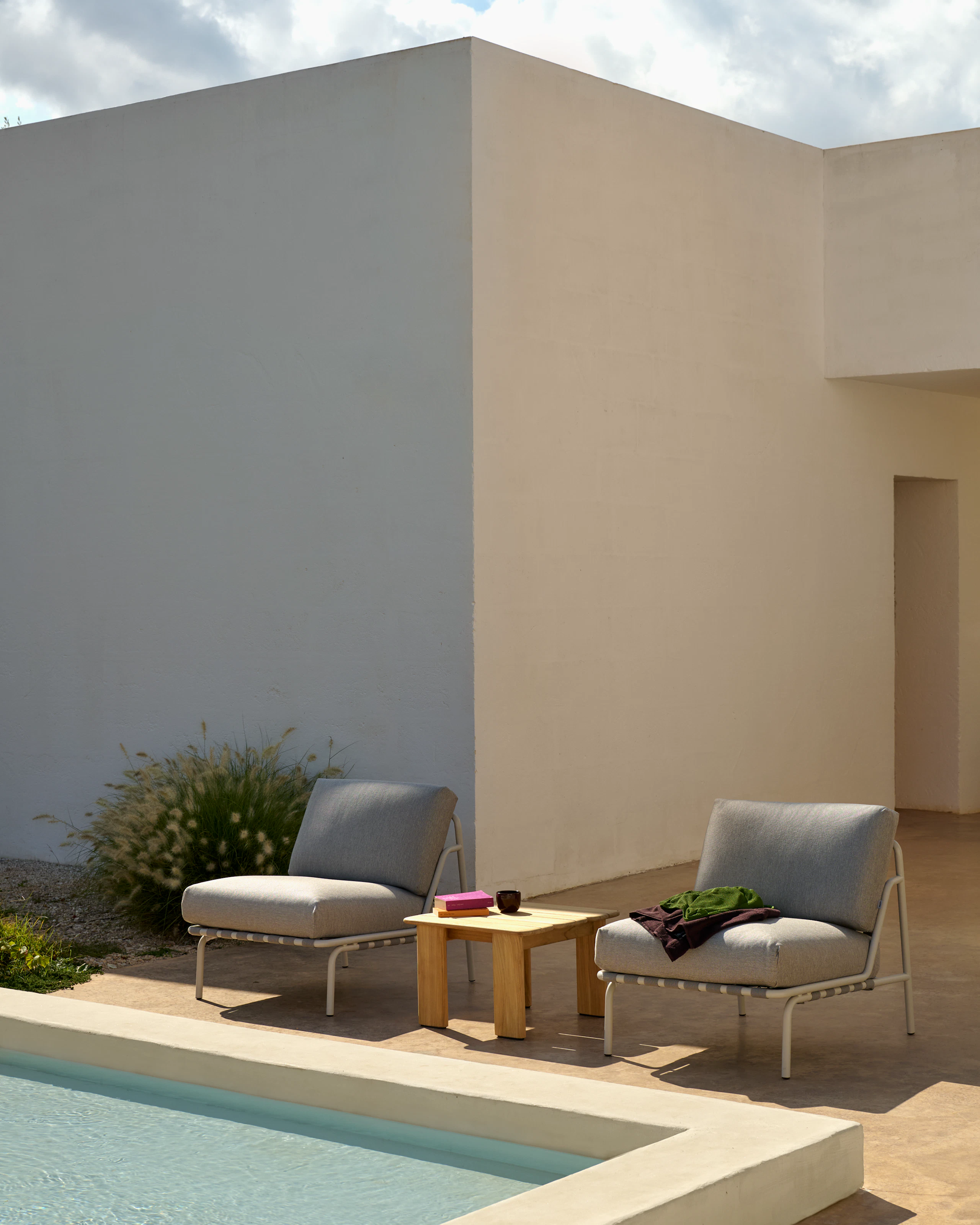 An environmental shot of the Settle Lounge Chair in Grey.