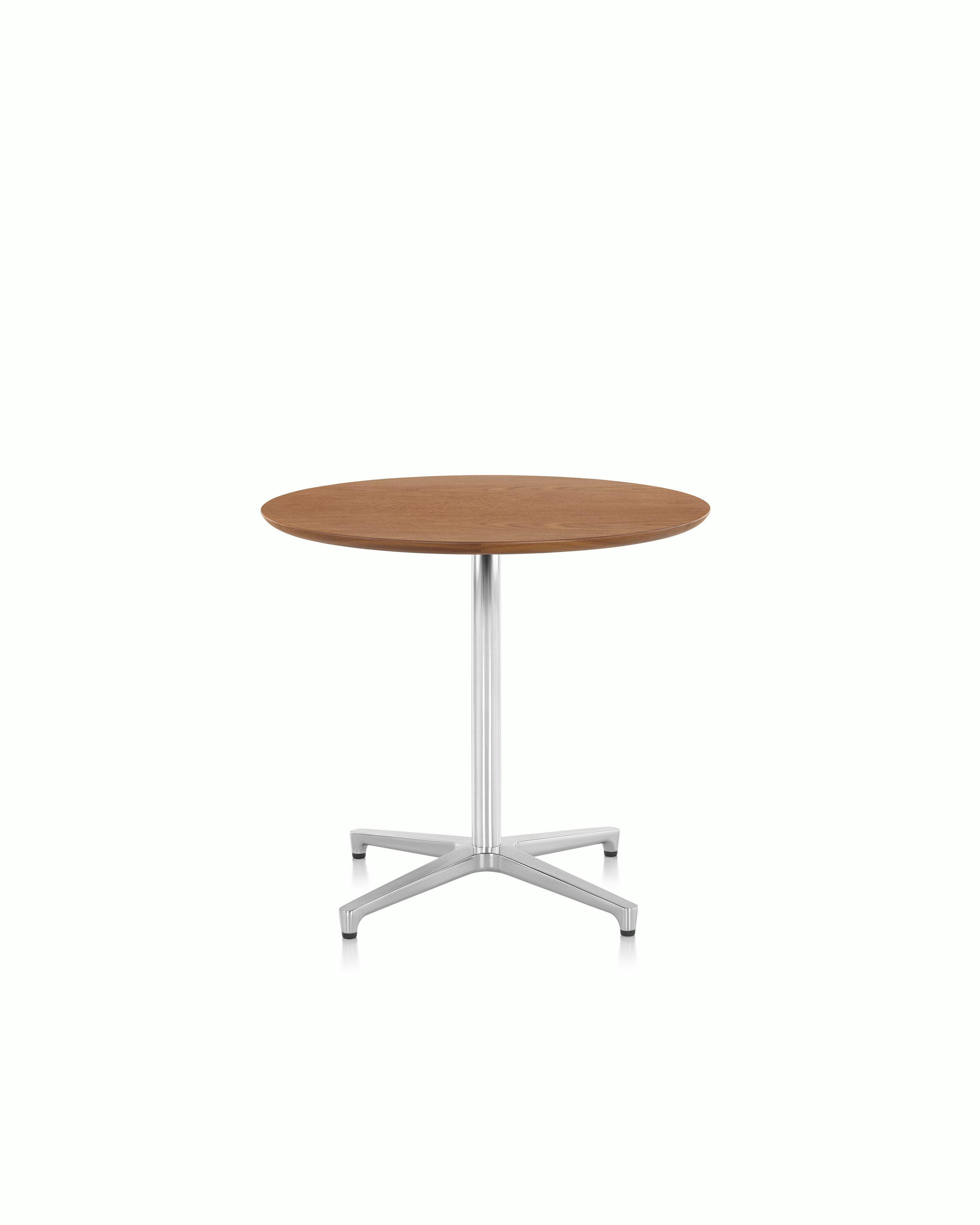 Close-up of the aluminum pedestal base on a round Saiba occasional table.