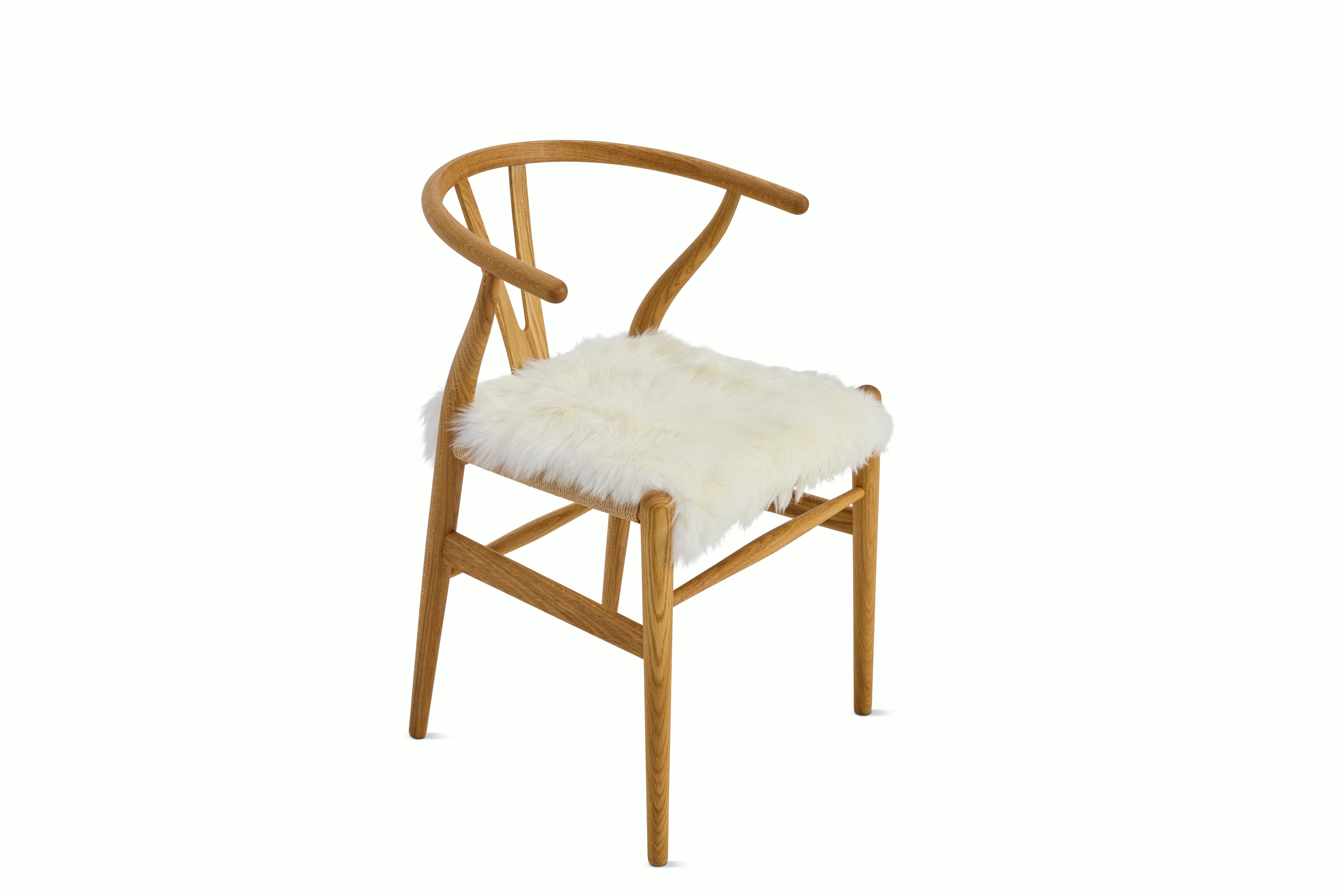 A detailed look at Sheepskin Seat Throw in Ivory Wishbone.