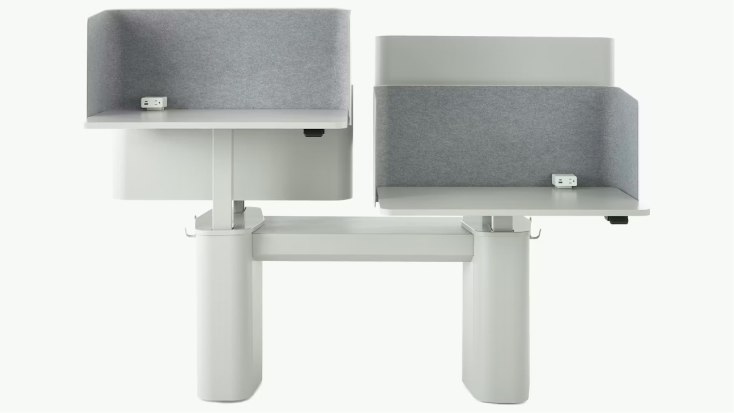 Dual OE1 Micro Pack workstation with curved side panels, fabric privacy screens, integrated power outlets, and a central support unit.