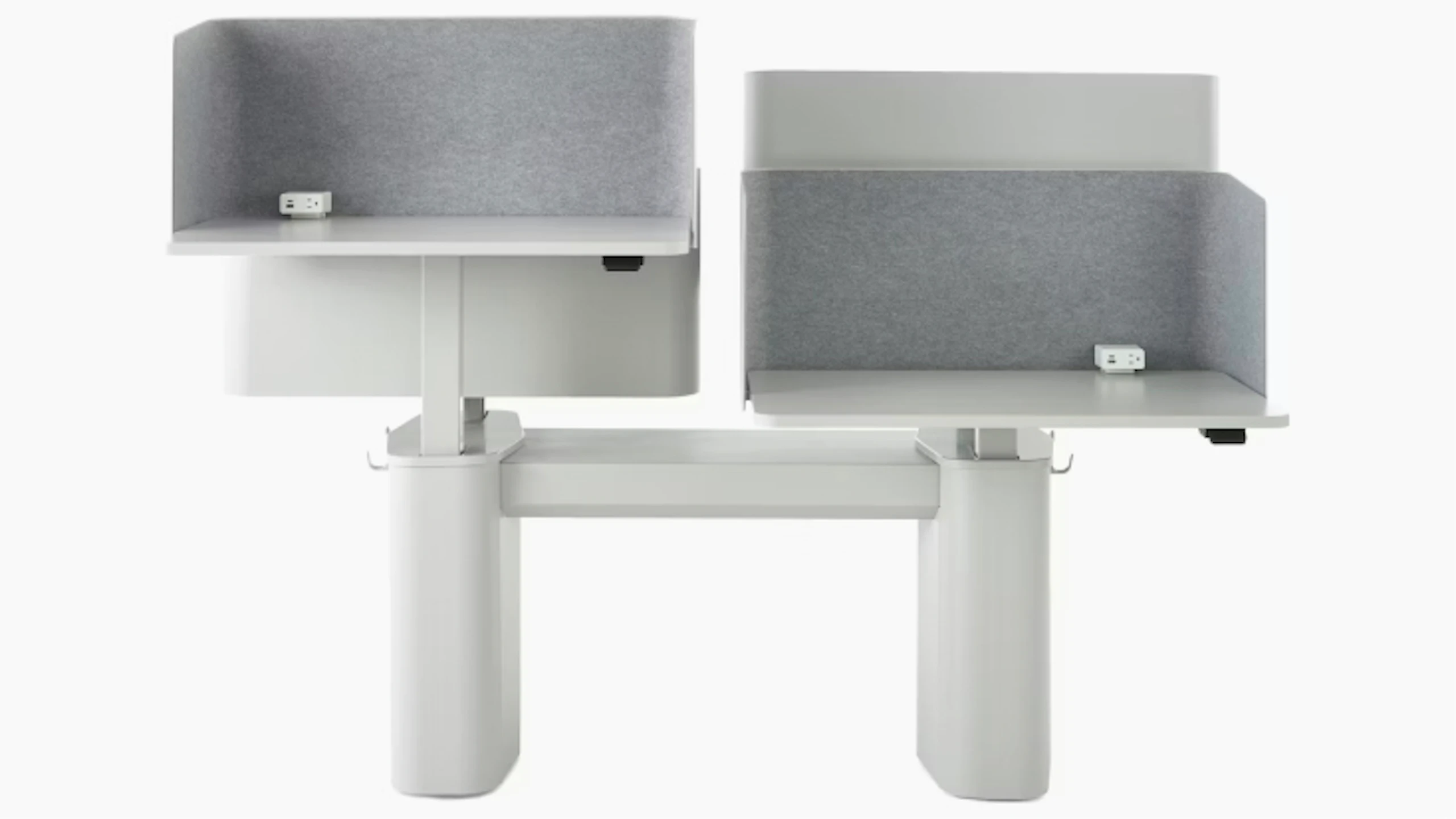 Dual OE1 Micro Pack workstation with curved side panels, fabric privacy screens, integrated power outlets, and a central support unit.