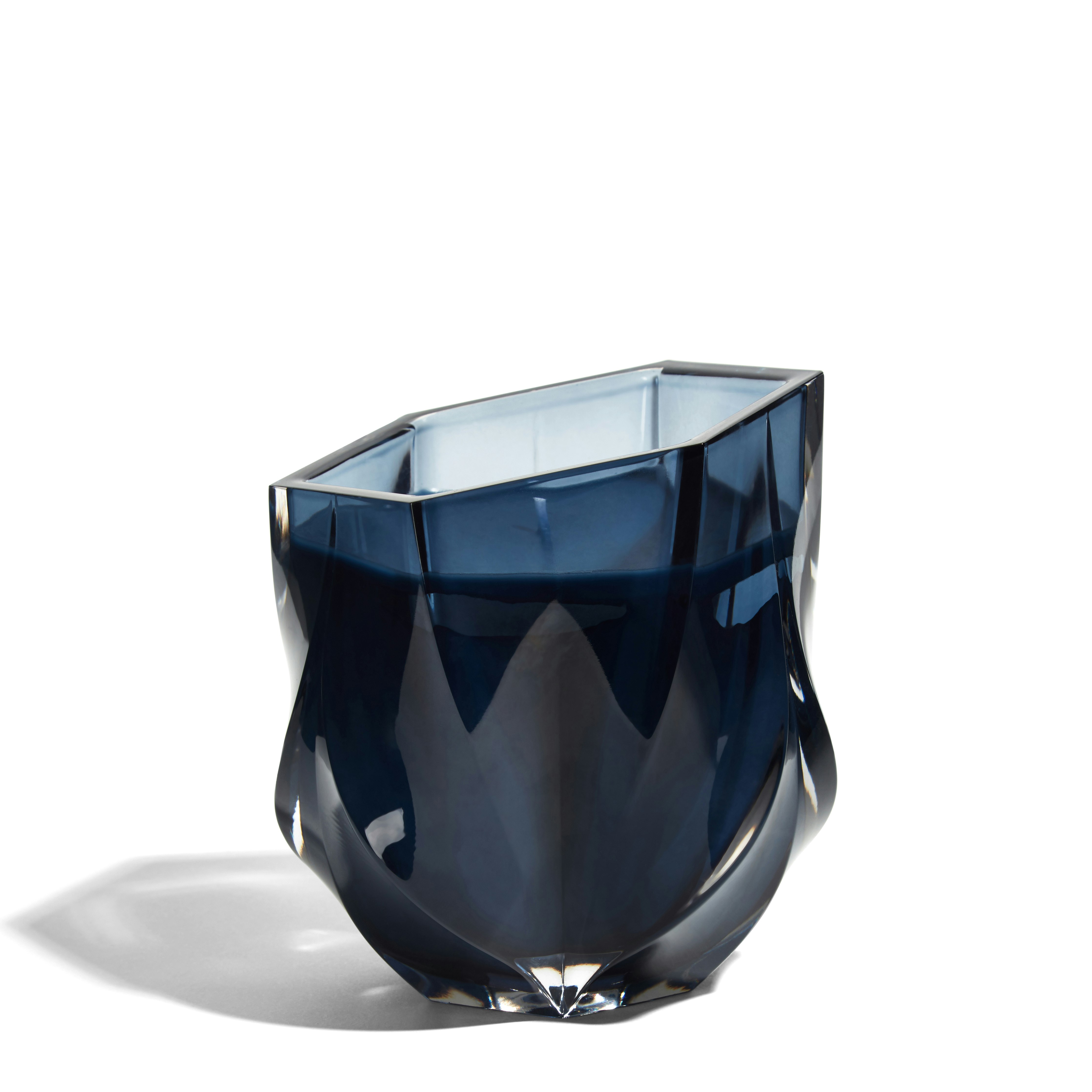 A Shimmer Scented Candle in Slate Blue viewed from an angle.