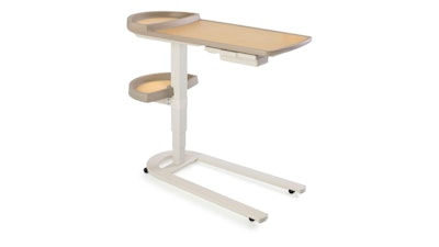 A front three-quarter view of a Mirage Overbed Table by Herman Miller with a light-wood finish.