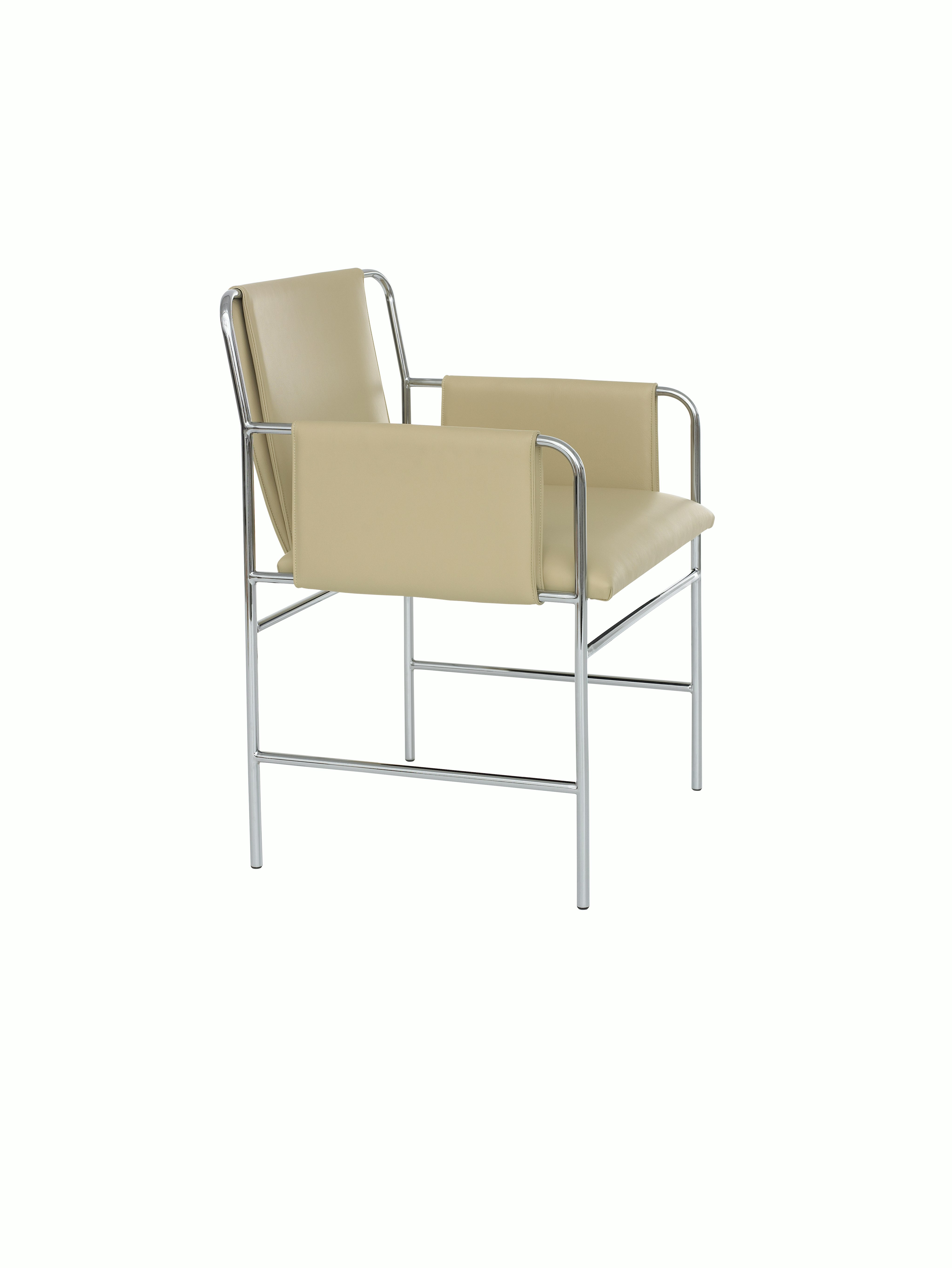 Angled view of an Envelope side chair with beige leather upholstery and a tubular steel frame.