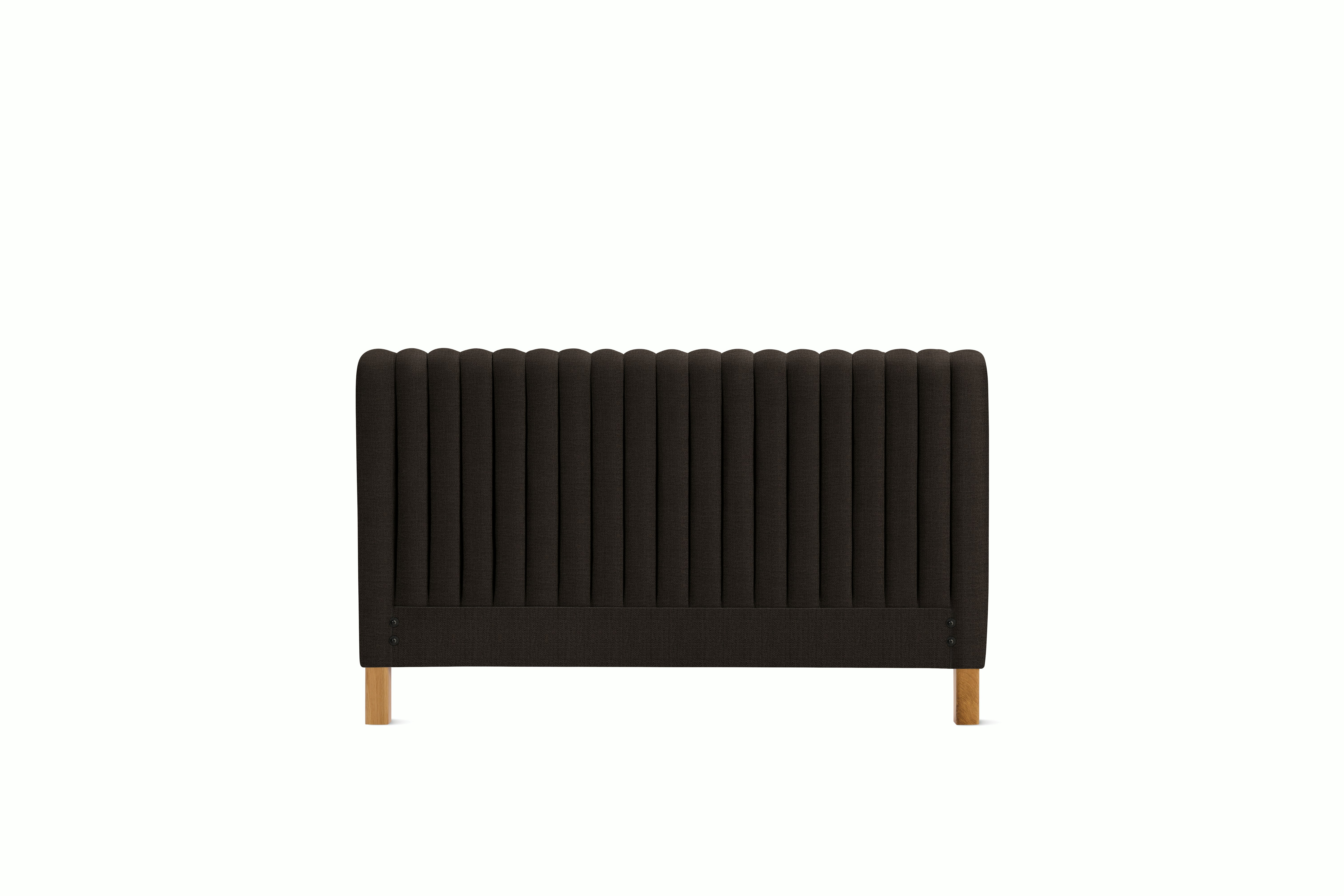 A Charlotte Headboard in Chocolate viewed from an angle.