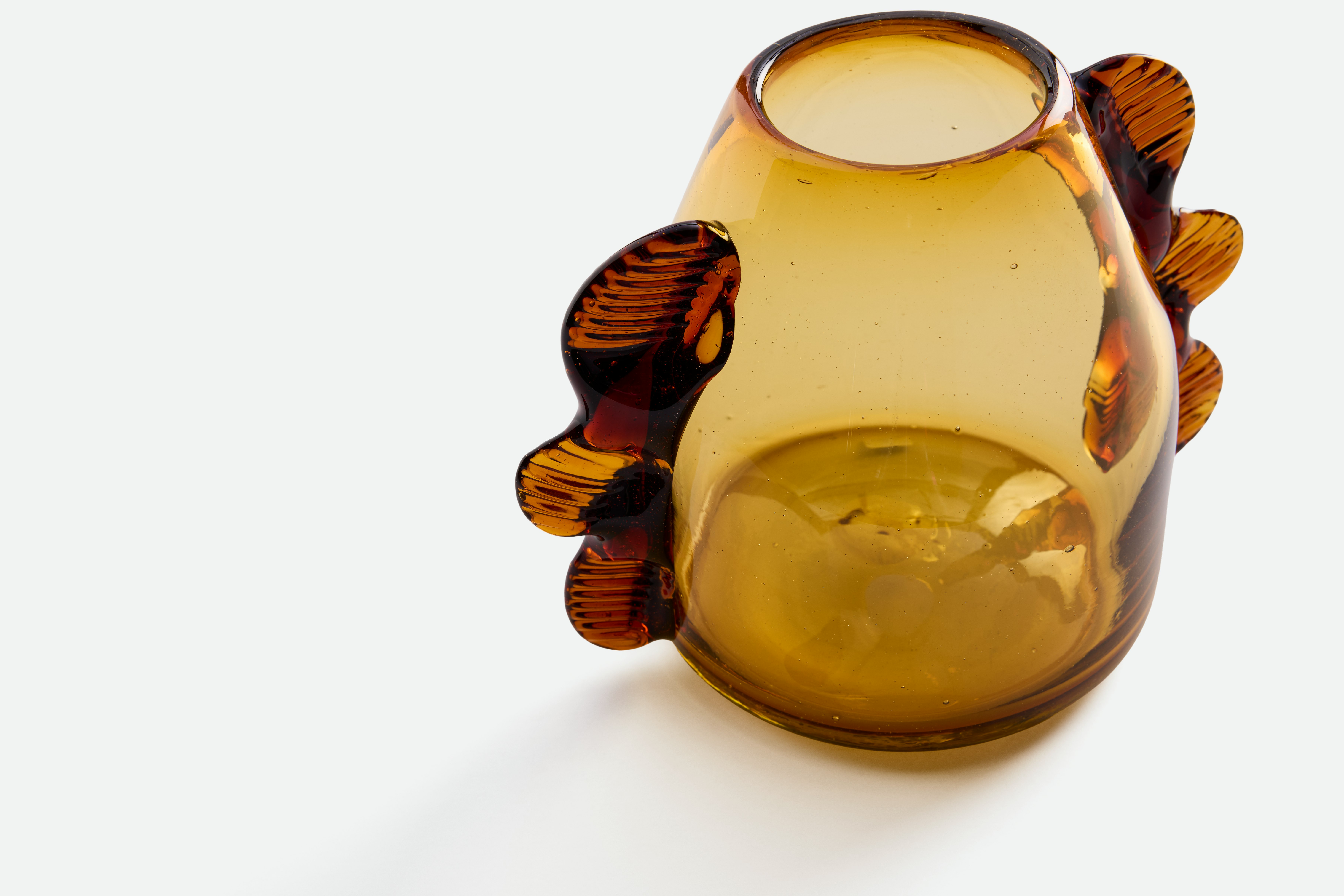 A detailed look at a Dalia Bud Vase in Amber.
