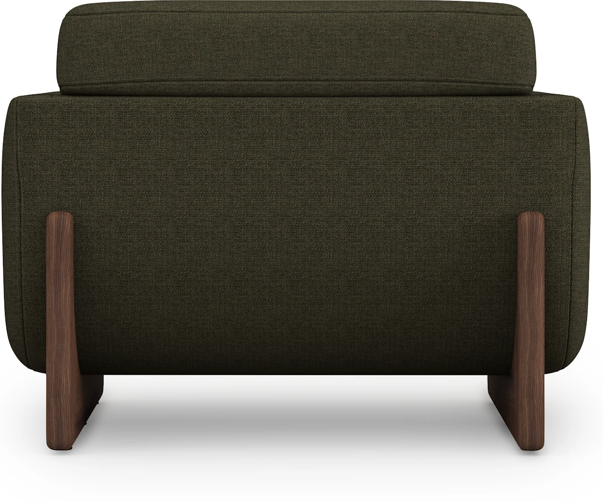 Dark green sofa close-up with wooden base and matching armrests.