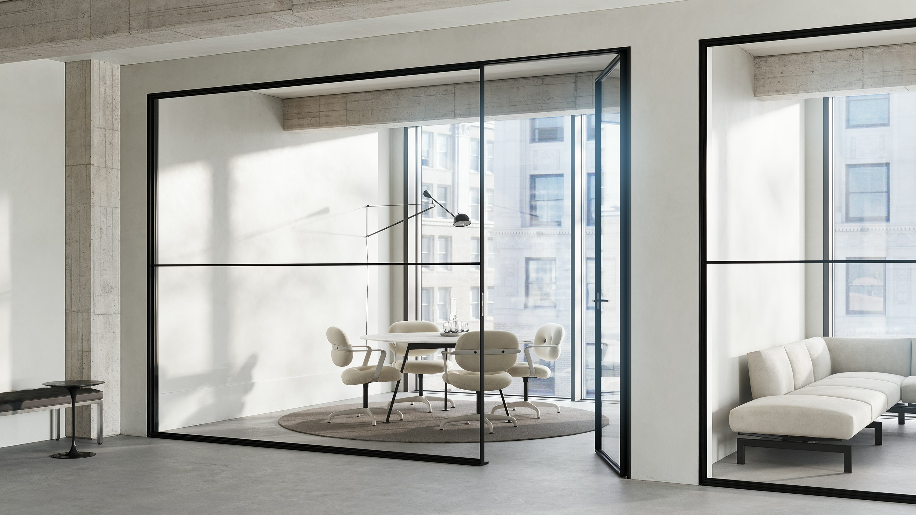 Four Morrison Hannah side chairs with arms surround a table in an office respite space.
