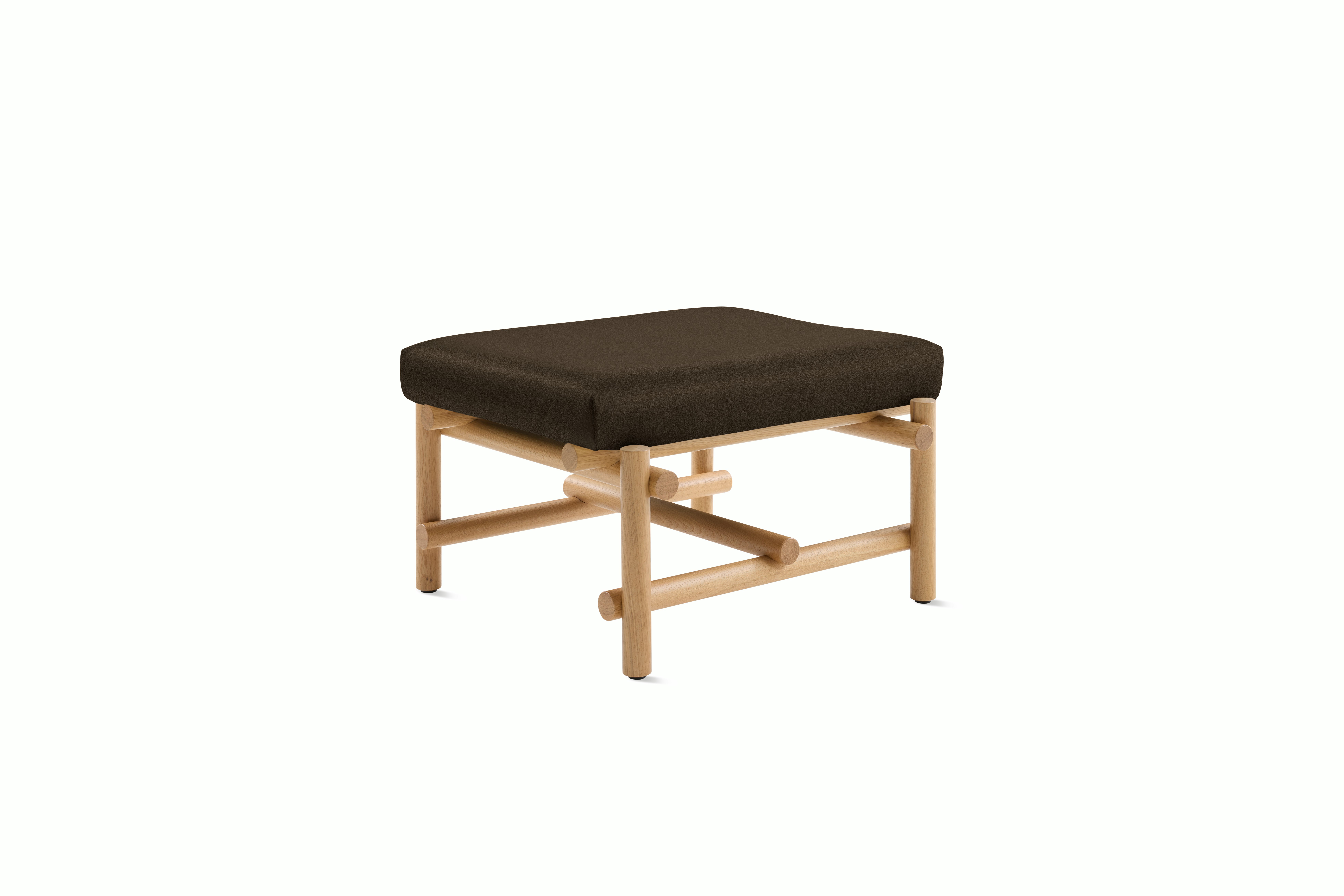A Muecke Ottoman in Desert Tortoise White Oak viewed from an angle.