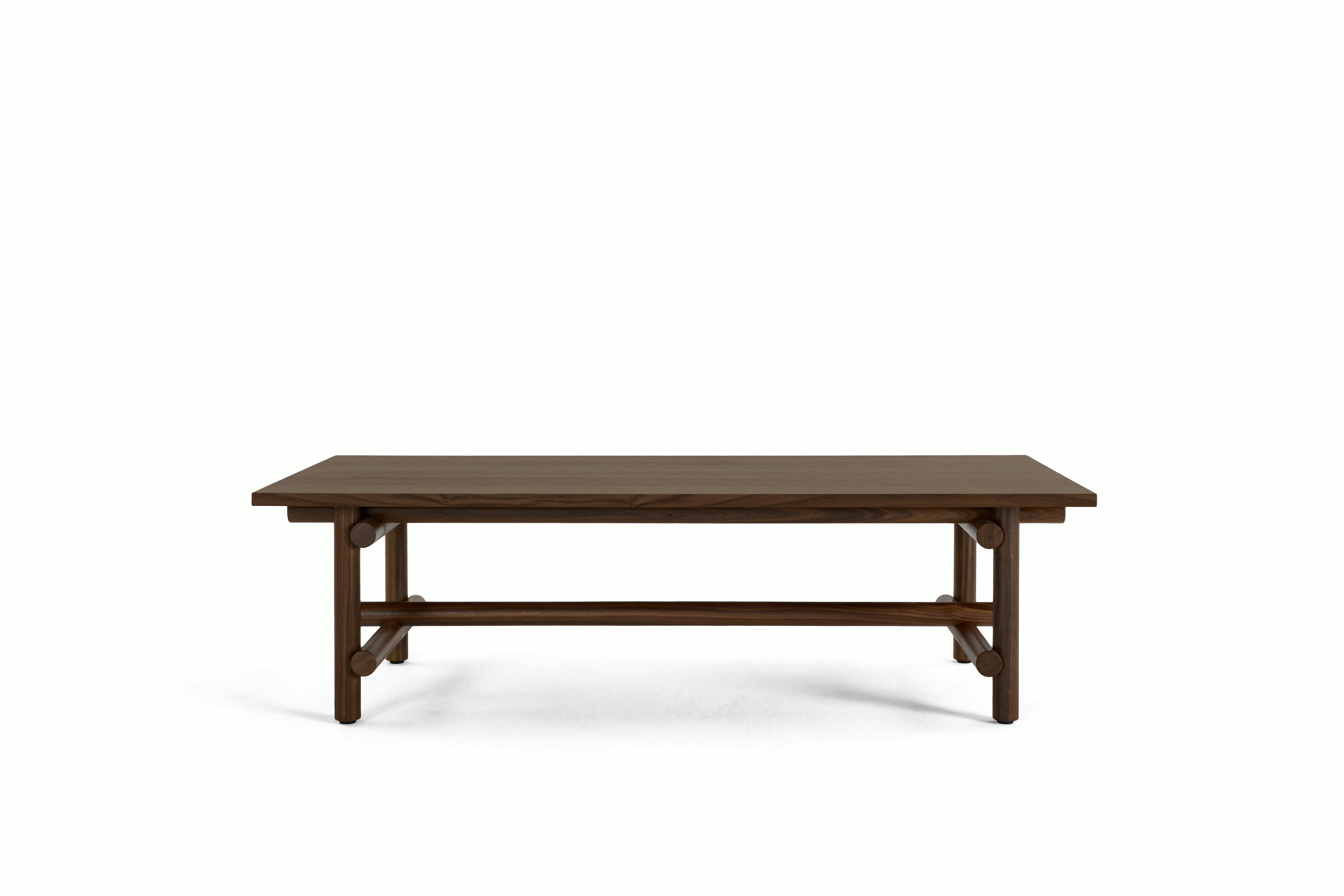 A Muecke Coffee Table in Walnut viewed from the front.