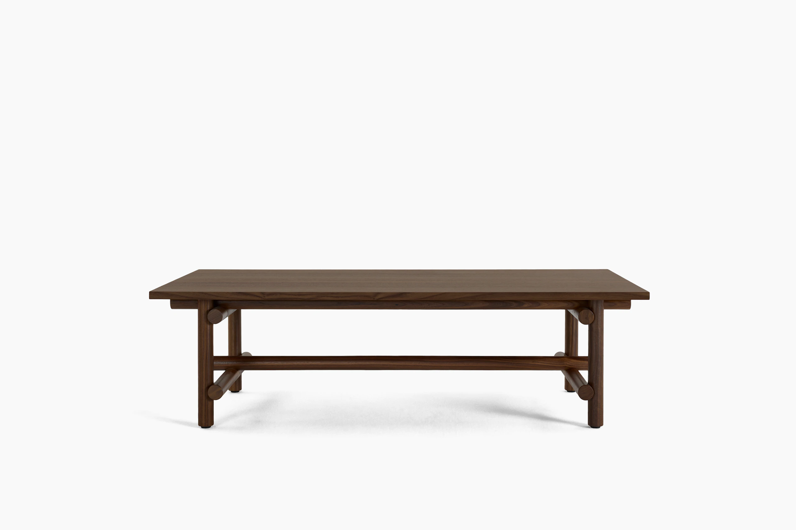 A Muecke Coffee Table in Walnut viewed from the front.