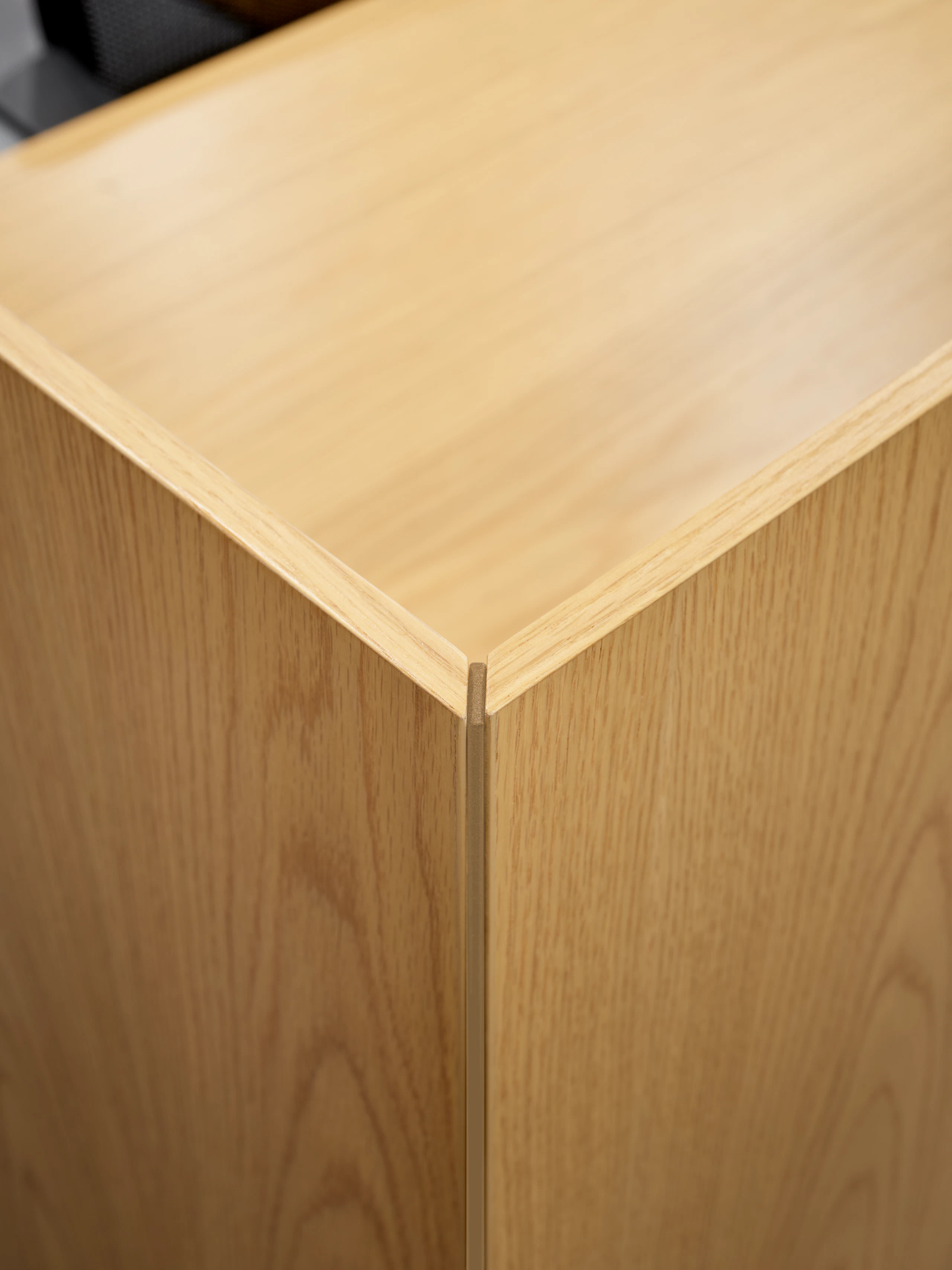 This detail style image is of a mitered edge for desk mounted veneer screen.