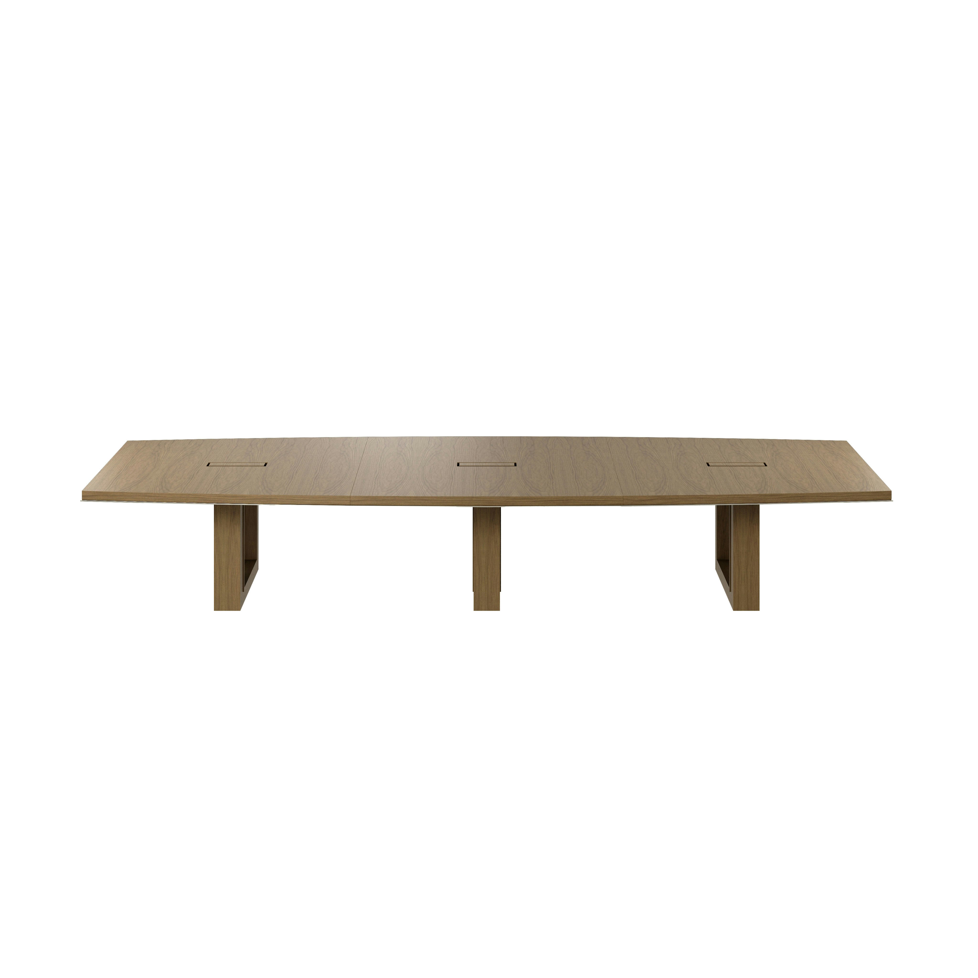 Boat-shaped Highline Fifty Conference Table in Natural Flat Cut Walnut with a Satin Nickel edge viewed from the front.