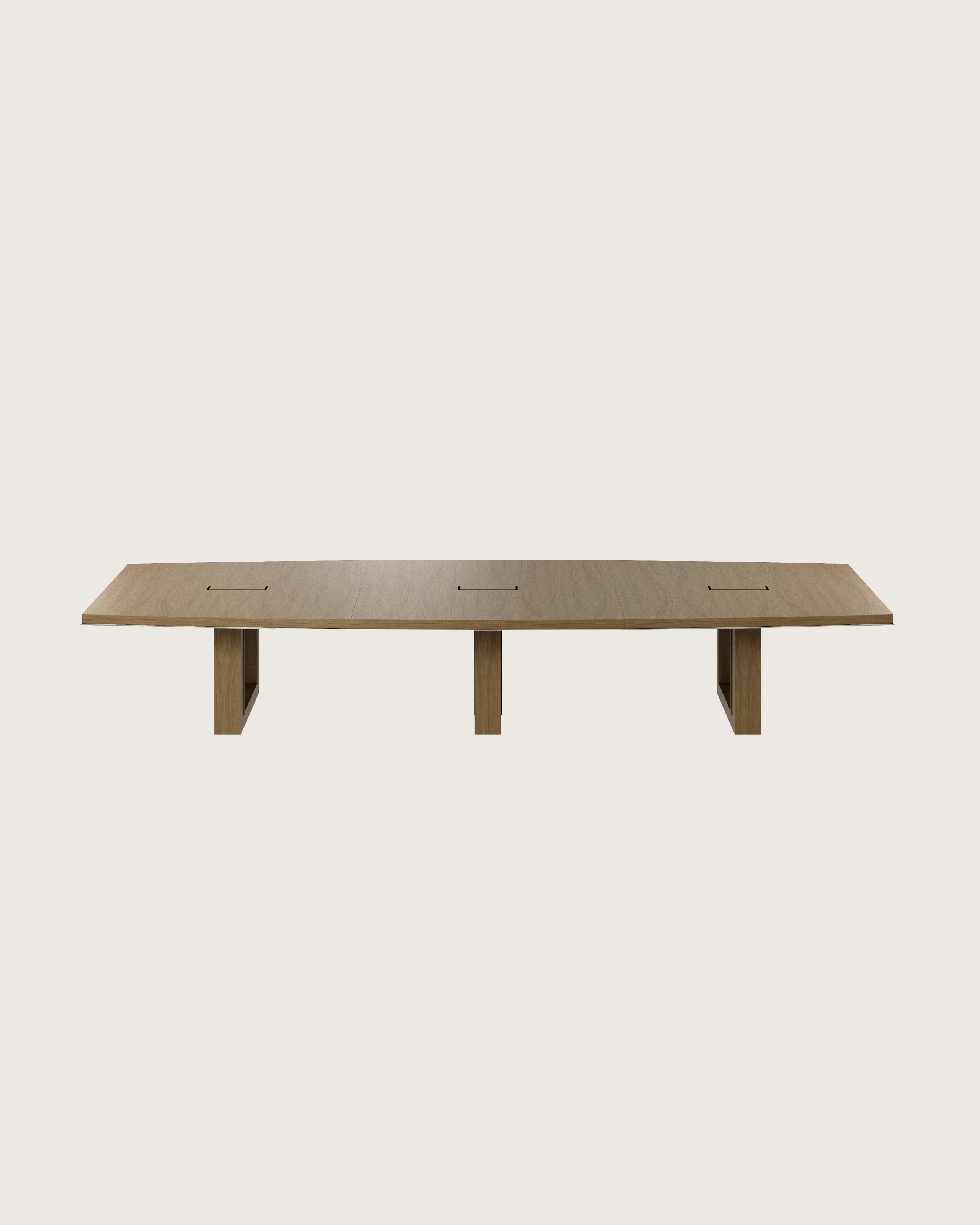 Boat-shaped Highline Fifty Conference Table in Natural Flat Cut Walnut with a Satin Nickel edge viewed from the front.