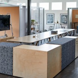 rockwell unscripted creative wall shared walls open room cork phone booths library table upholstered steps plywood steps tall table drink rail upholstered seats round swivel stools mobile media cart muuto fiber side chairs hospitality team meeting