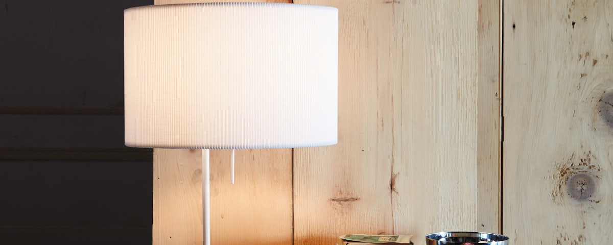 Pleat Drum Table Lamp on a side table in a living room setting