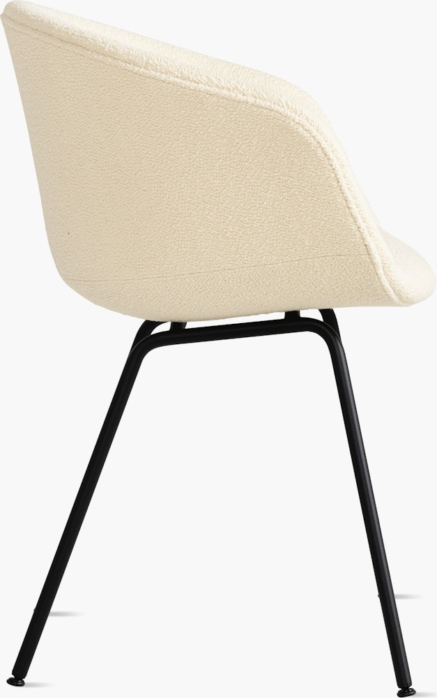 A side view of the AAC 27 Soft About a Chair Upholstered Armchair with a metal base.