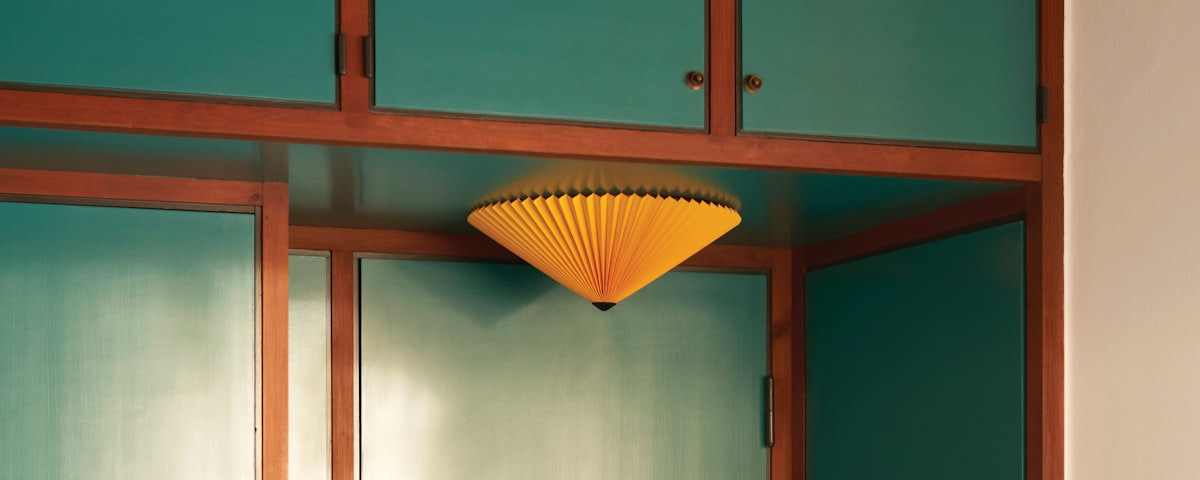 Matin Flush Mount Lamp in a bedroom setting