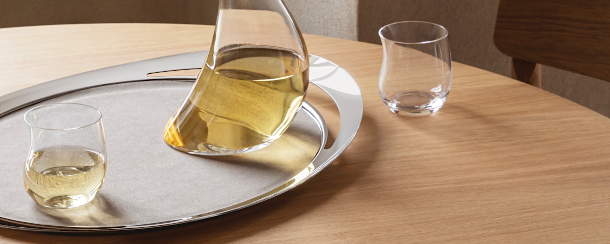 Cobra Serving Tray with a wine carafe and wine glass on a dining table