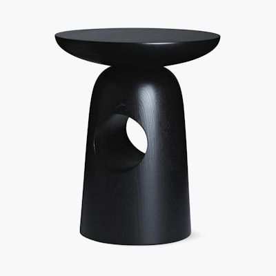A Hew Side Table in a painted black finish.
