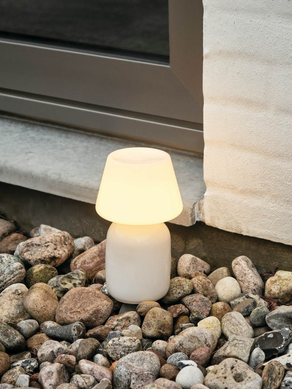 Apollo Portable Lamp in an outdoor patio setting
