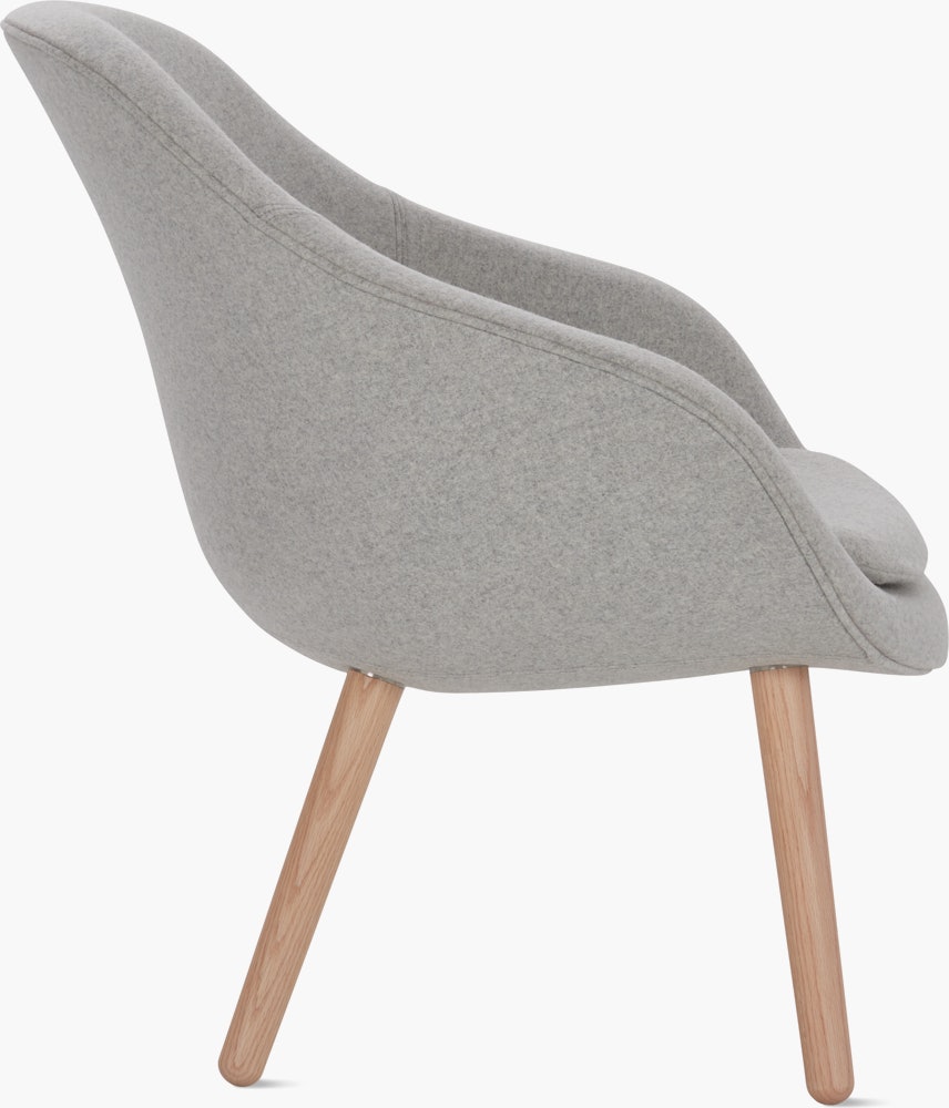 A light grey About a Lounge 82 Armchair with low back viewed from the side