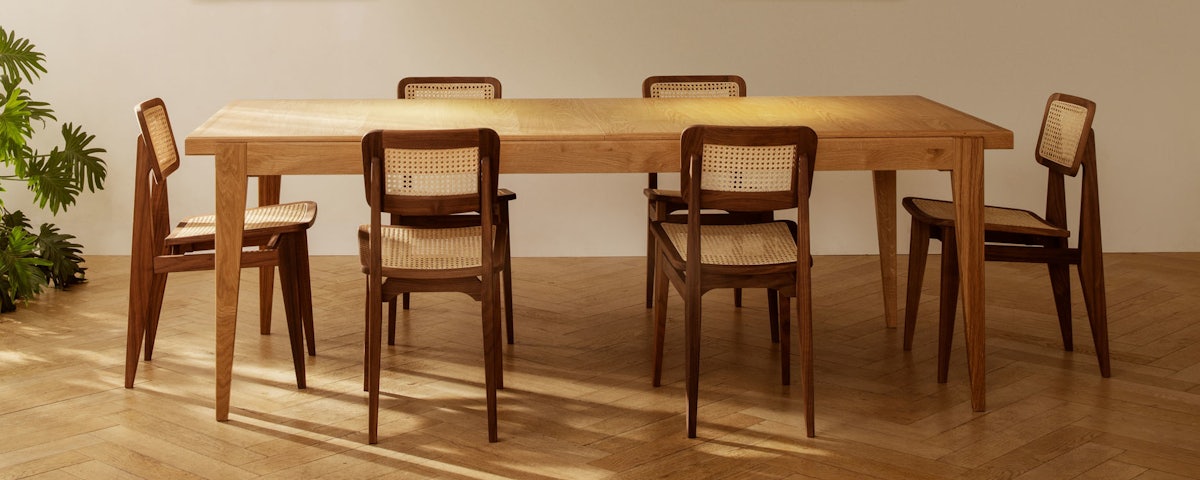 C Chairs surrounding a dining table in a dining room setting