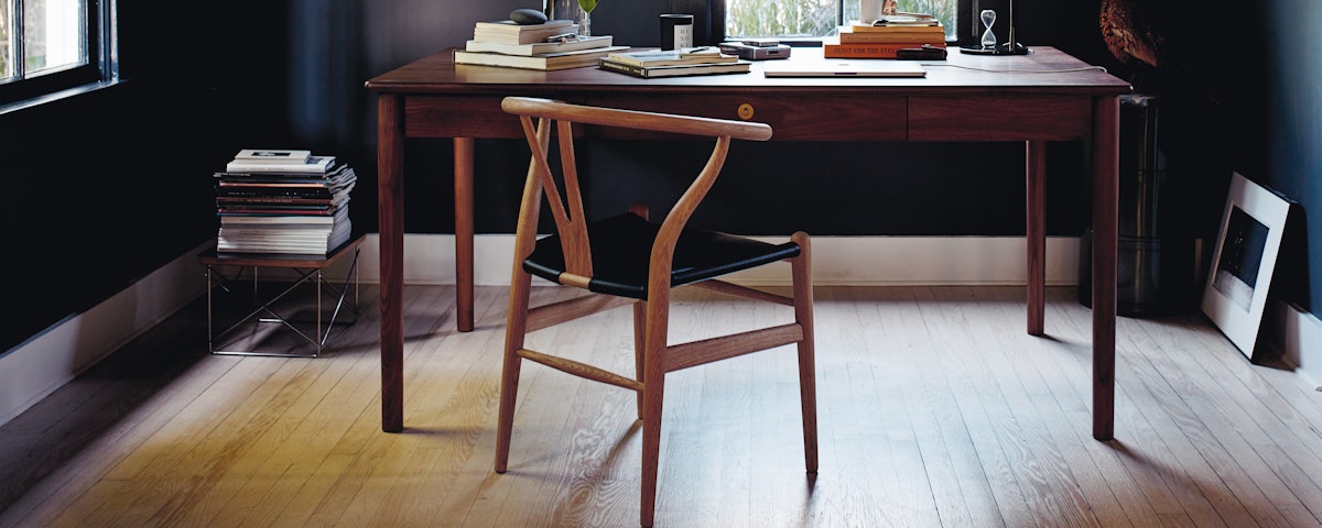 Edel Table and Wishbone Chair with Leather Seat in a home office setting