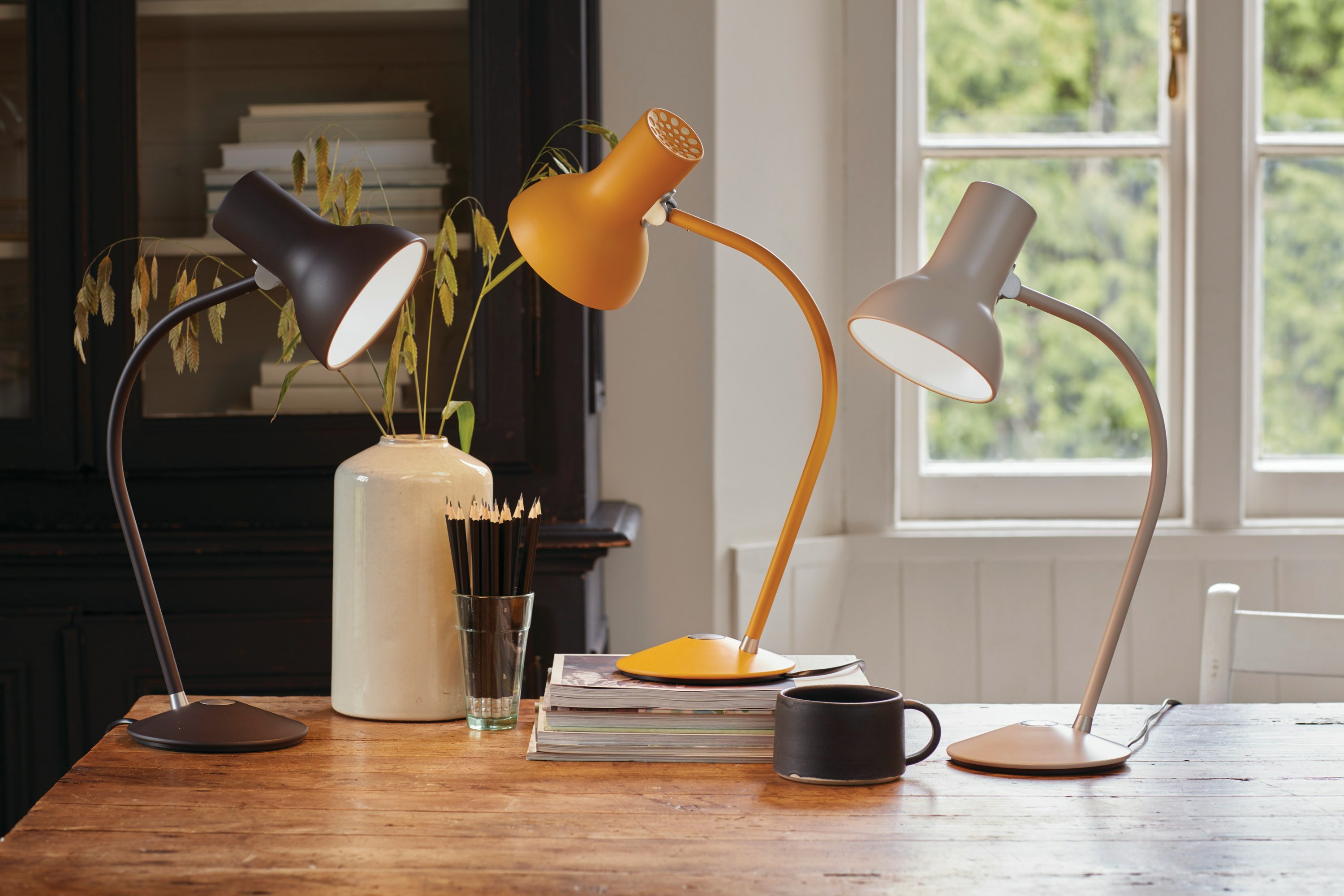 Three Type 75 Mini Table Lamps on a desk in a home office setting