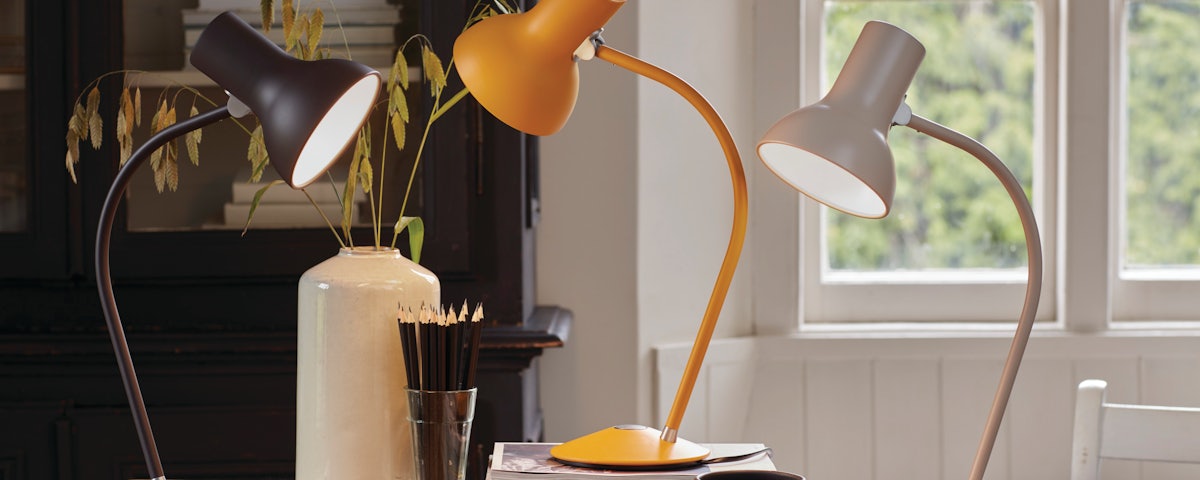 Three Type 75 Mini Table Lamps on a desk in a home office setting
