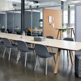 Rockwell Unscripted Community Space with Muuto rockwell unscripted library table tall table drink rail upholstered seat swivel stool creative wall filzfelt hanging panels fixed fins glass work lounge assembly community immersive open room semi enclosure muuto fiber side chair hospitality team meeting