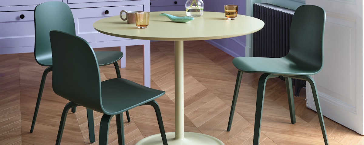 Soft Cafe Table and three About A Chair 12 Side Chairs in a dining room setting