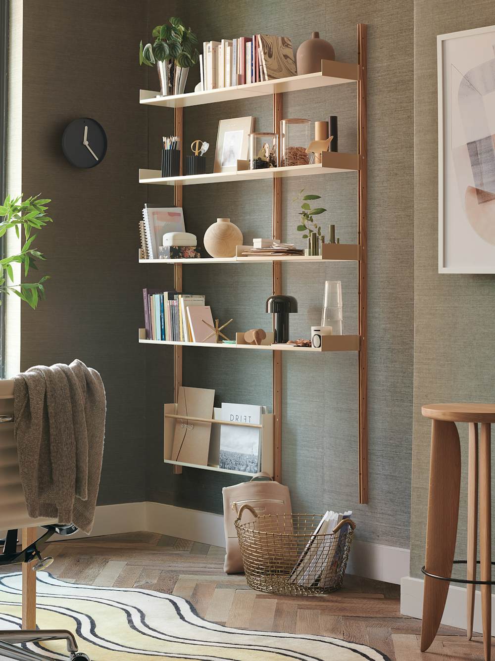 Modul Shelving, Thirteenth Stool, and Eames Aluminum Group Chair in a home office setting