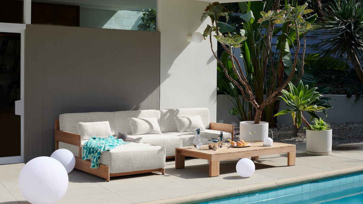 Esplanade Outdoor Sectional and Coffee Table by the pool