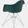 Back angle of evergreen plastic shell chair with wire base legs.