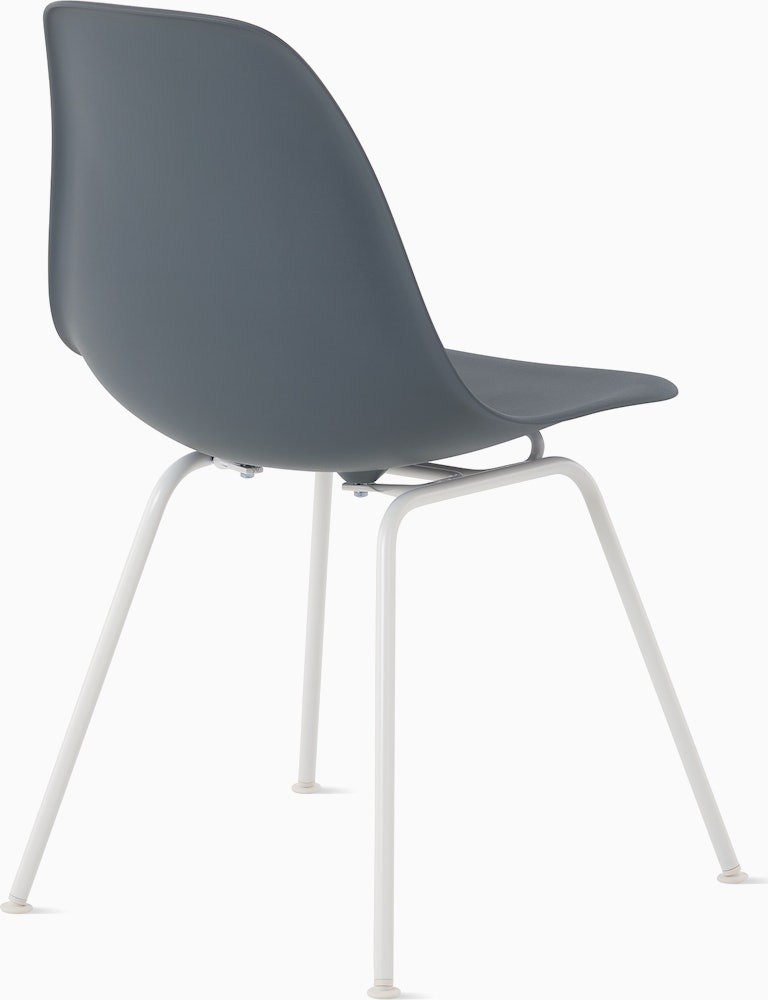 Back angle of medium grey plastic shell chair on 4-leg base.