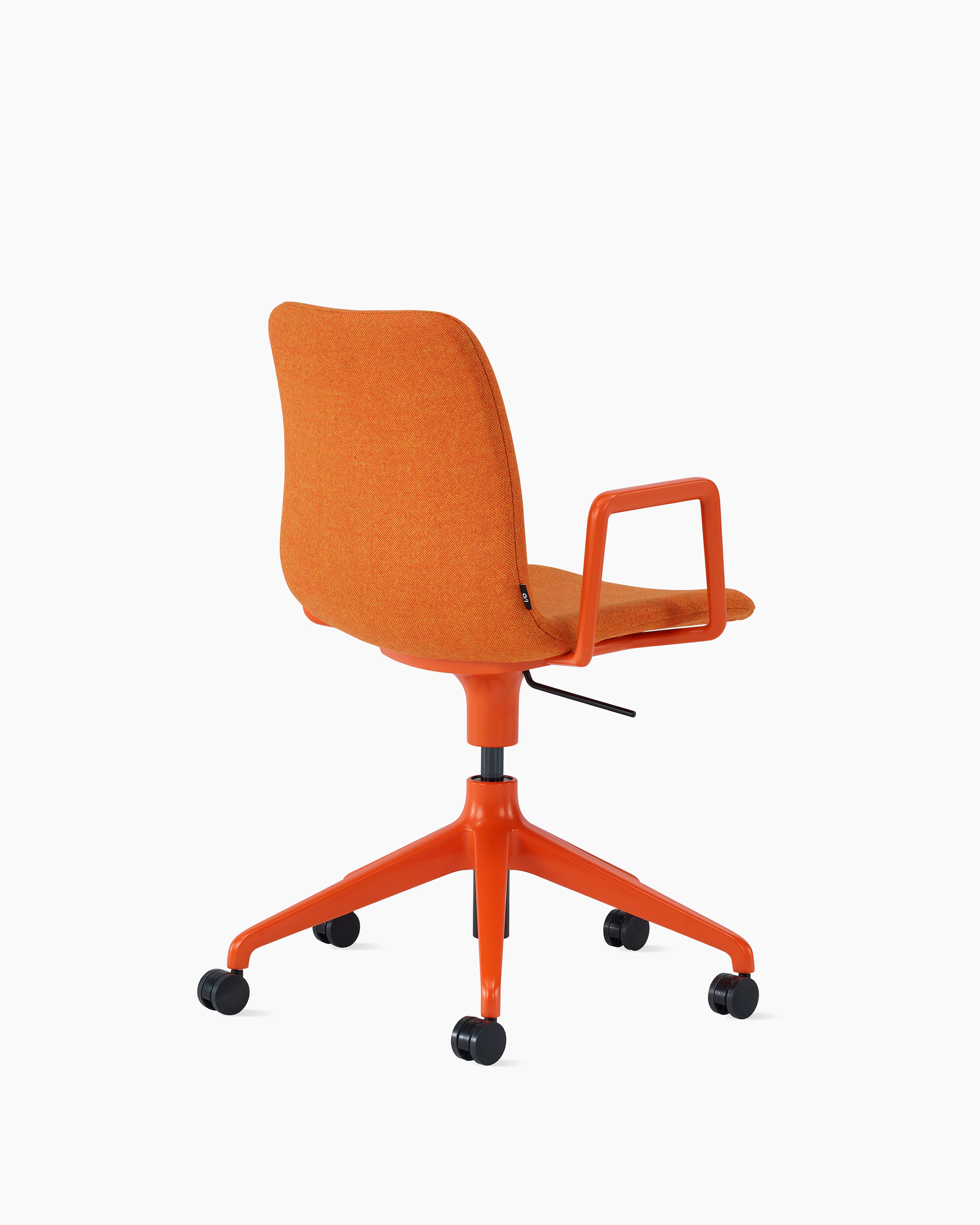 An orange upholstered NaughtOne Viv Chair with metal armrests and 5-star base, viewed at an angle.