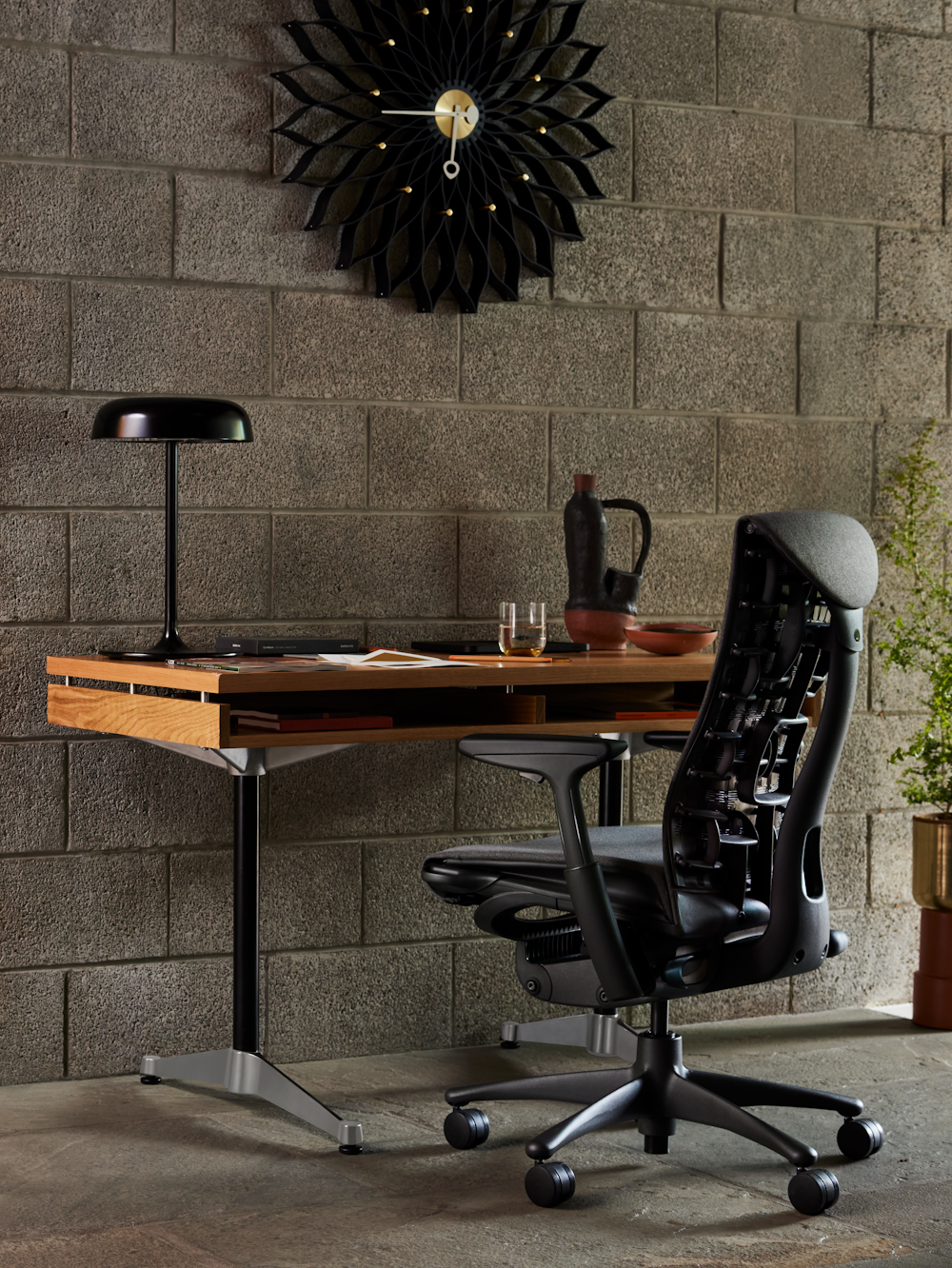 Embody Chair,  Eames 2500 Series Executive Desk,  Ode Desk Lamp,  Nelson Sunflower Clock