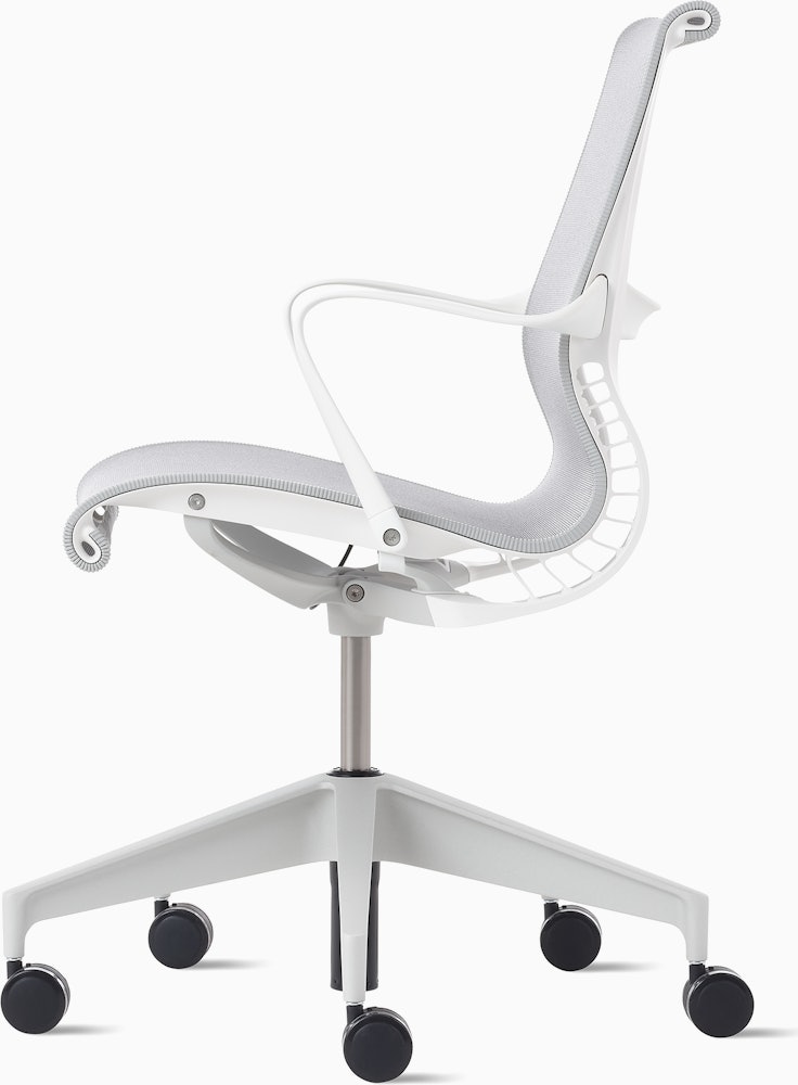 Side view of a Setu chair with grey suspension, white frame and silver alloy base.